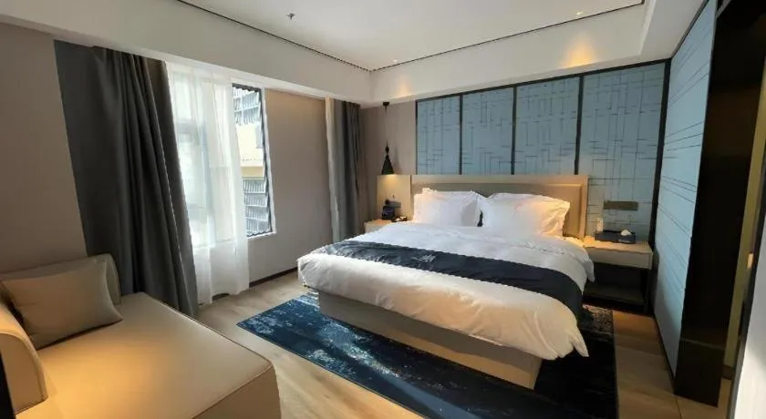 Bed in Echarm Hotel Changjiang Shilu