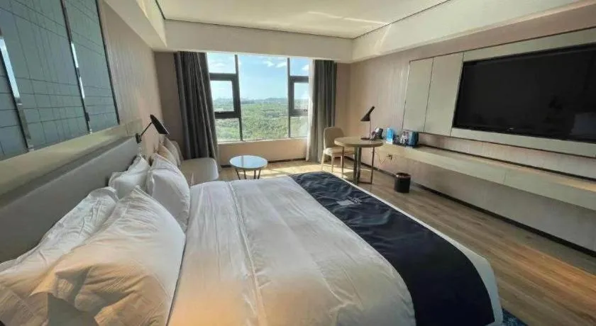 Bed in Echarm Hotel Changjiang Shilu