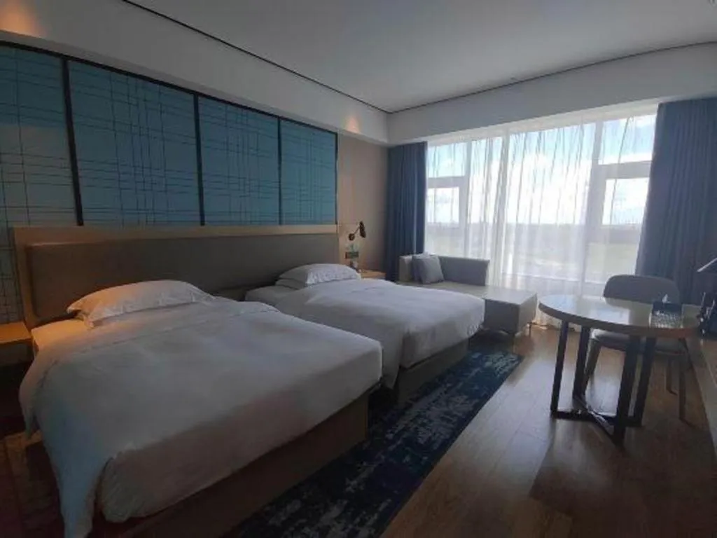 Bed in Echarm Hotel Changjiang Shilu
