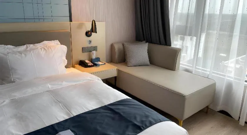 Bed in Echarm Hotel Changjiang Shilu