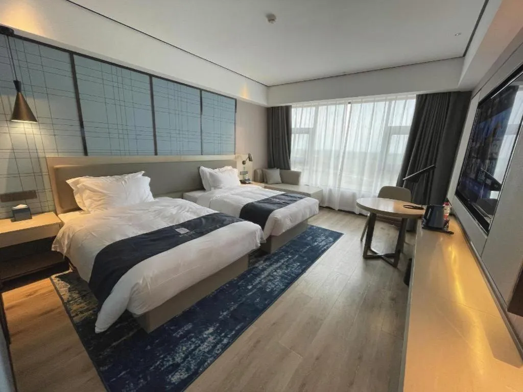 Bed in Echarm Hotel Changjiang Shilu