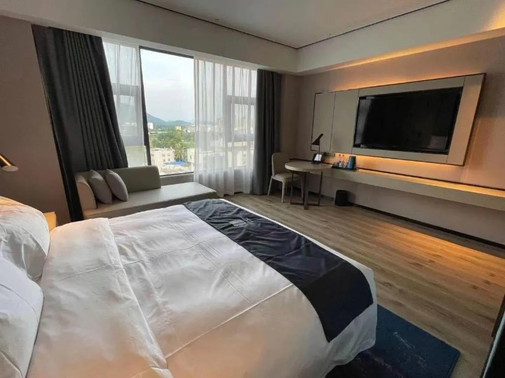 Bed in Echarm Hotel Changjiang Shilu