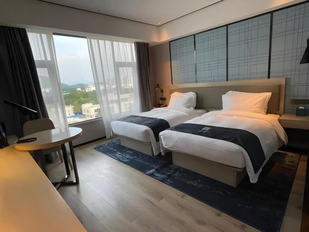 Bed in Echarm Hotel Changjiang Shilu