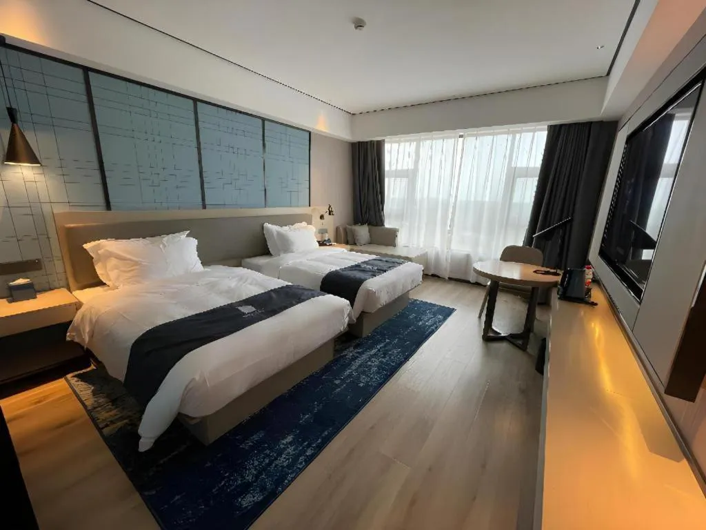 Bed in Echarm Hotel Changjiang Shilu
