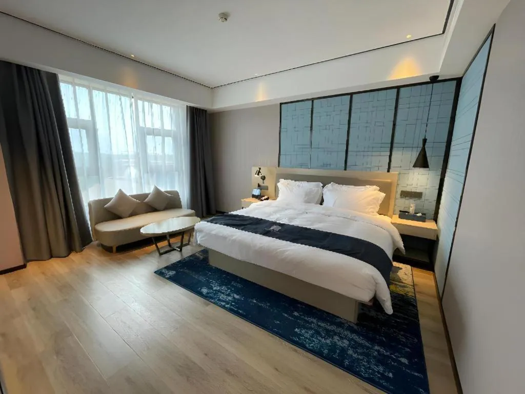 Bed in Echarm Hotel Changjiang Shilu