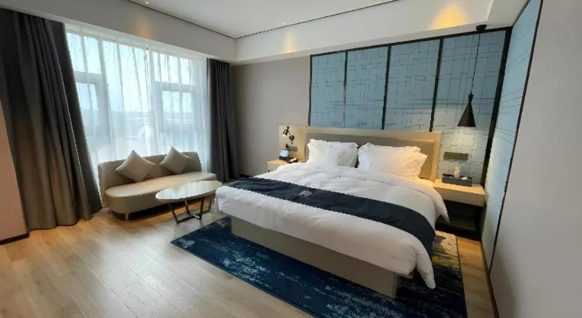 Bed in Echarm Hotel Changjiang Shilu