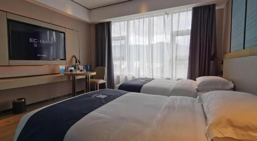 Bed in Echarm Hotel Changjiang Shilu