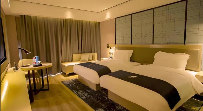 Bed in Echarm Hotel Changjiang Shilu