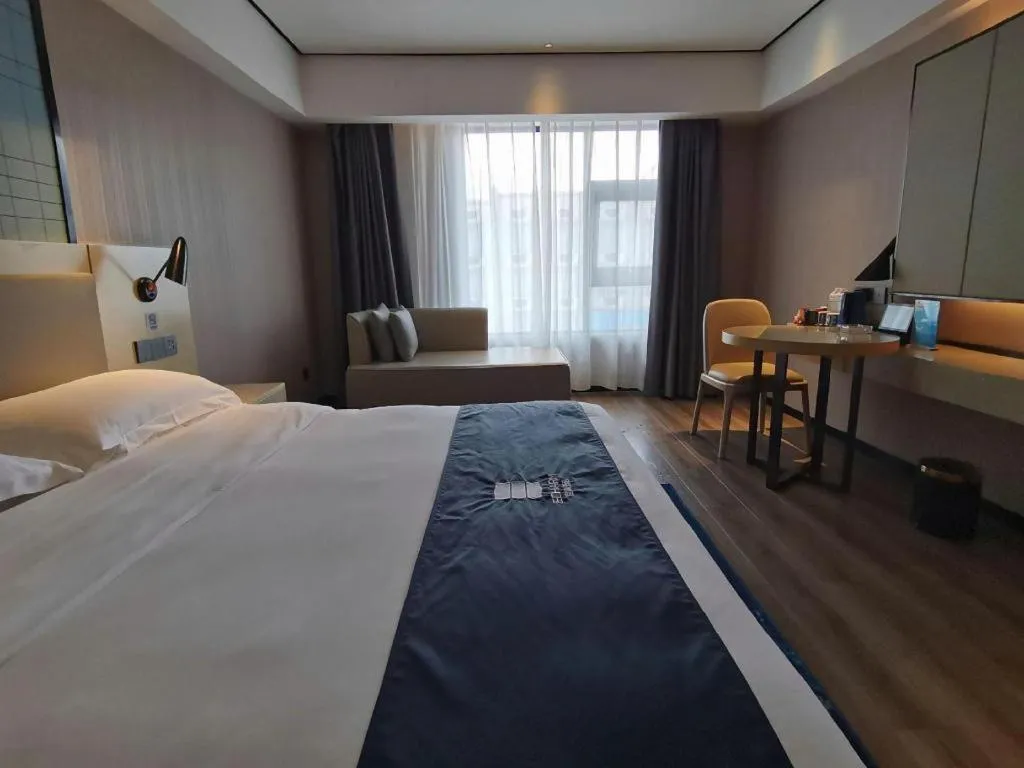 Bed in Echarm Hotel Changjiang Shilu