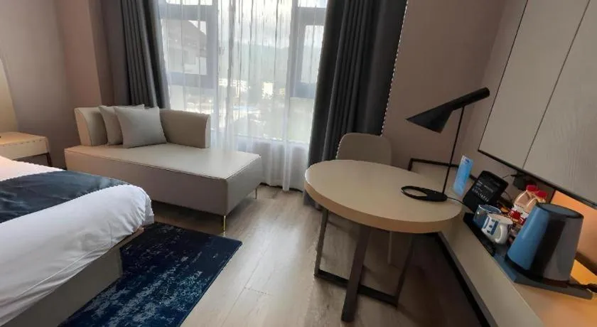 Bed in Echarm Hotel Changjiang Shilu