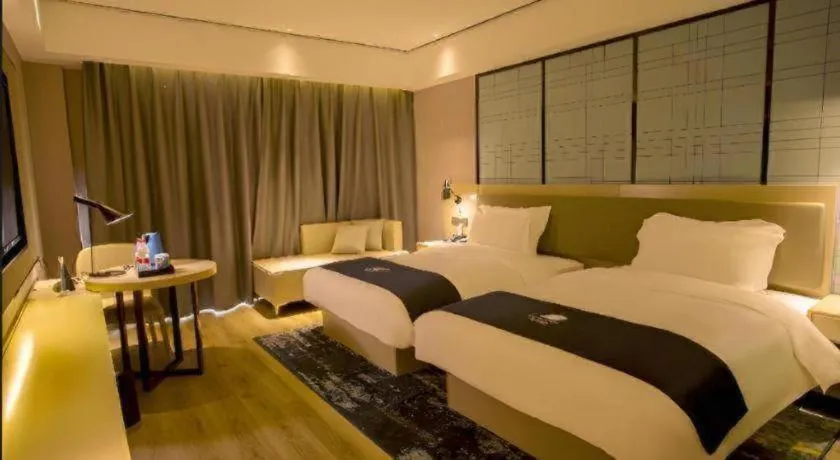 Bed in Echarm Hotel Changjiang Shilu