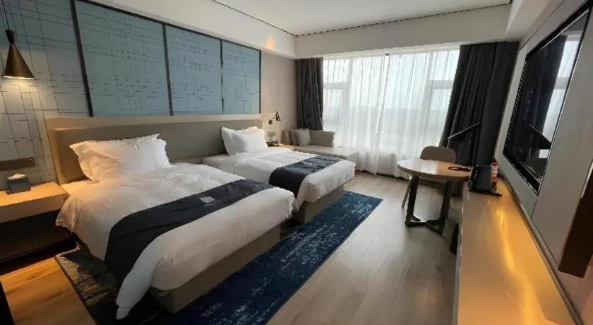 Bed in Echarm Hotel Changjiang Shilu
