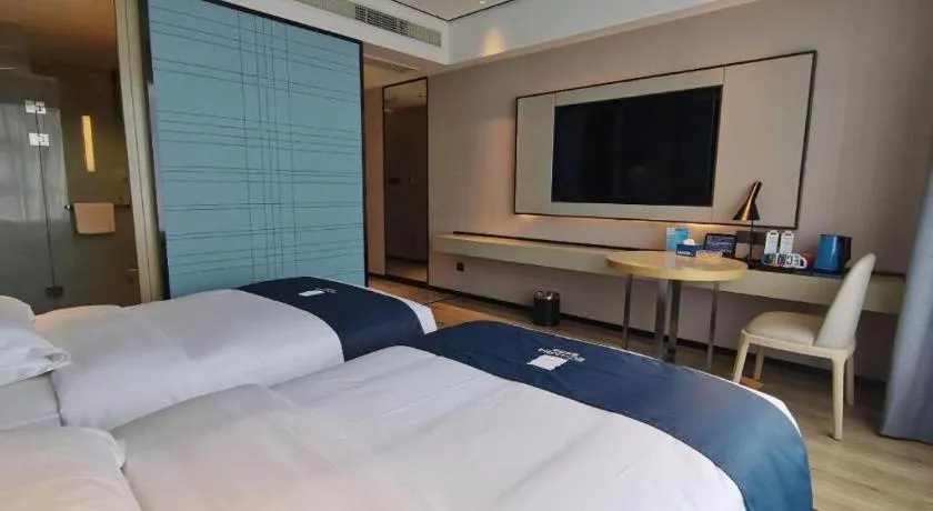 Bed in Echarm Hotel Changjiang Shilu