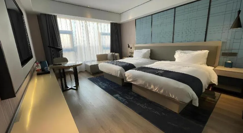 Bed in Echarm Hotel Changjiang Shilu