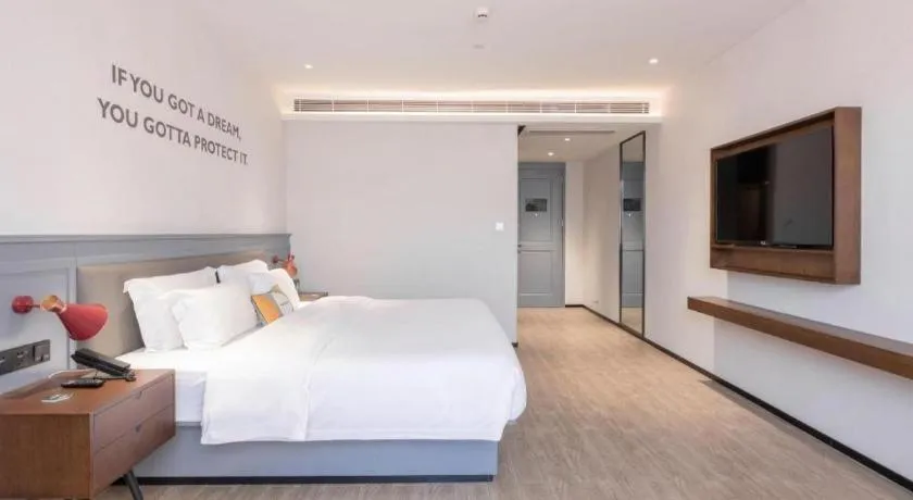 Bed in City Comfort Premier Hotel Nanning Guangxi University Zoo Metro Station