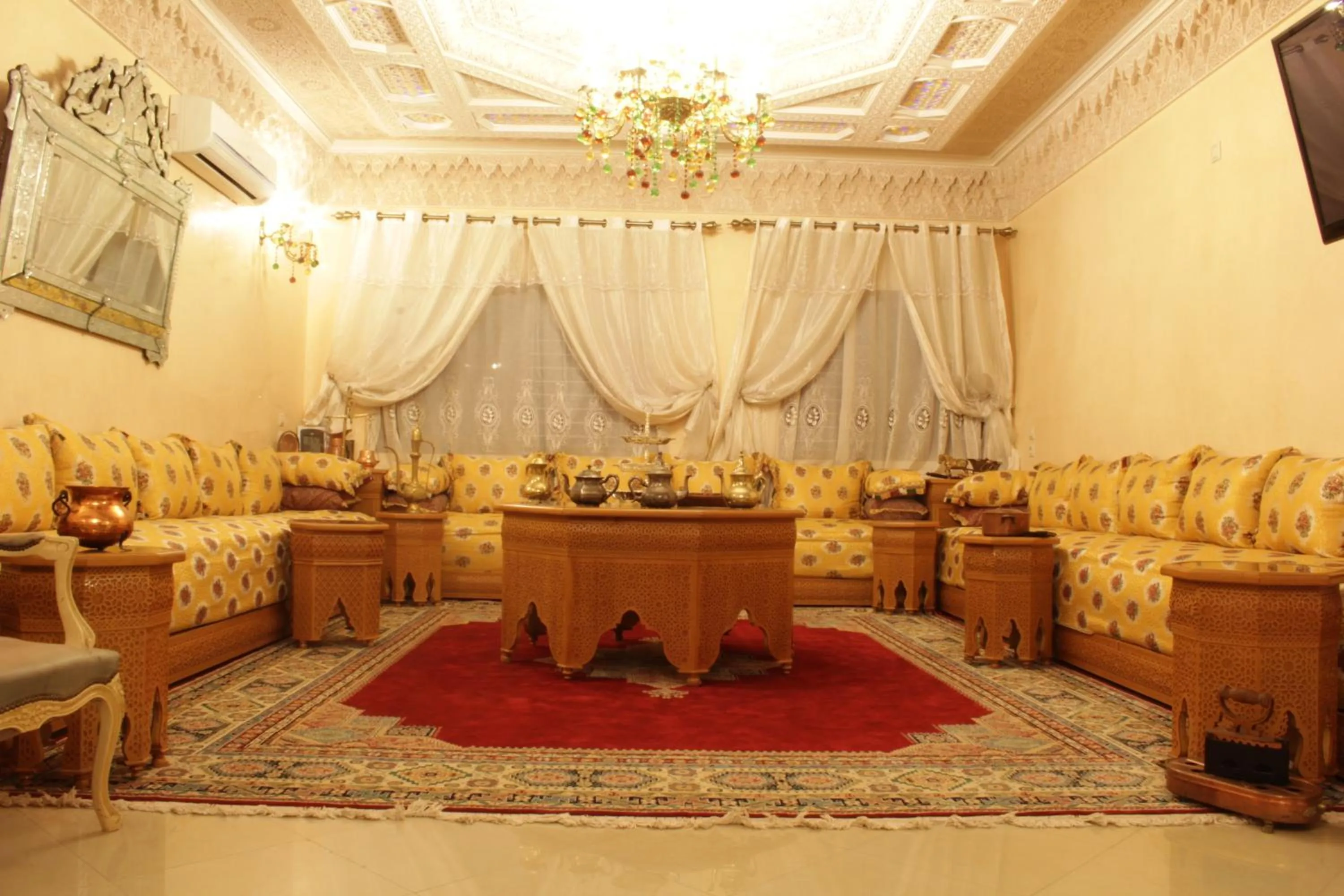 Communal lounge/ TV room in Riad Mimosa