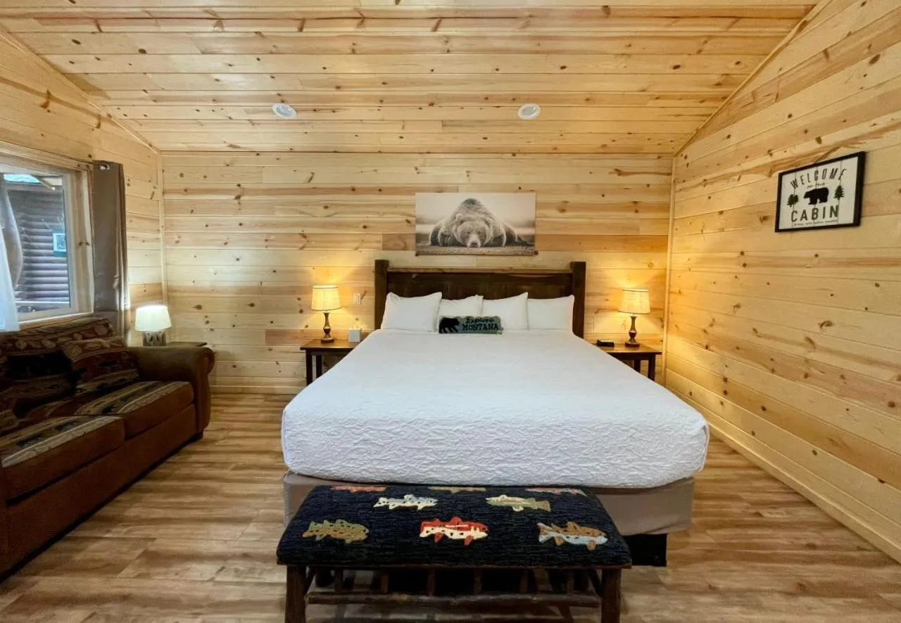 Bed in Riverfront Motel & Cabins