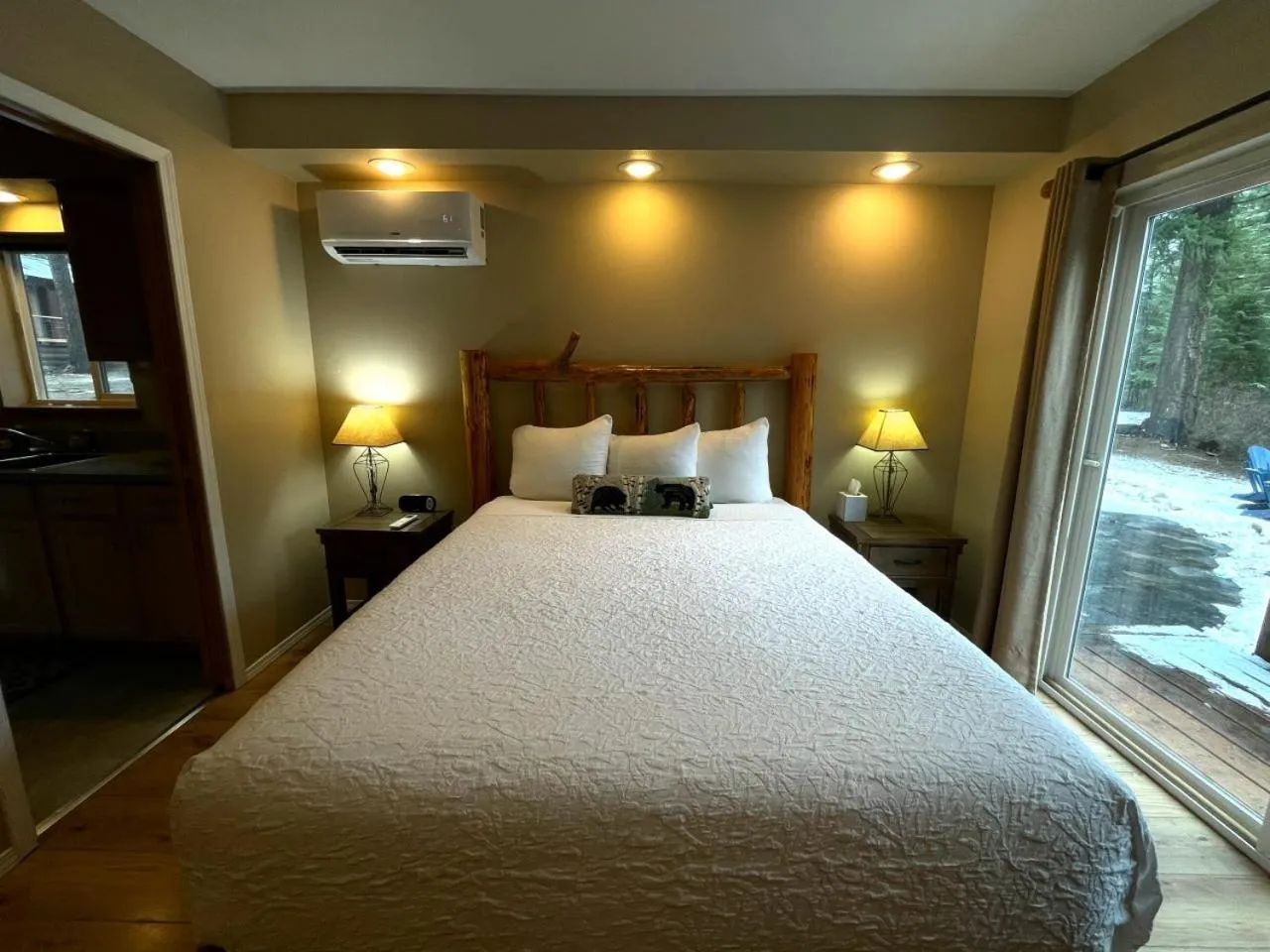 Bed in Riverfront Motel & Cabins