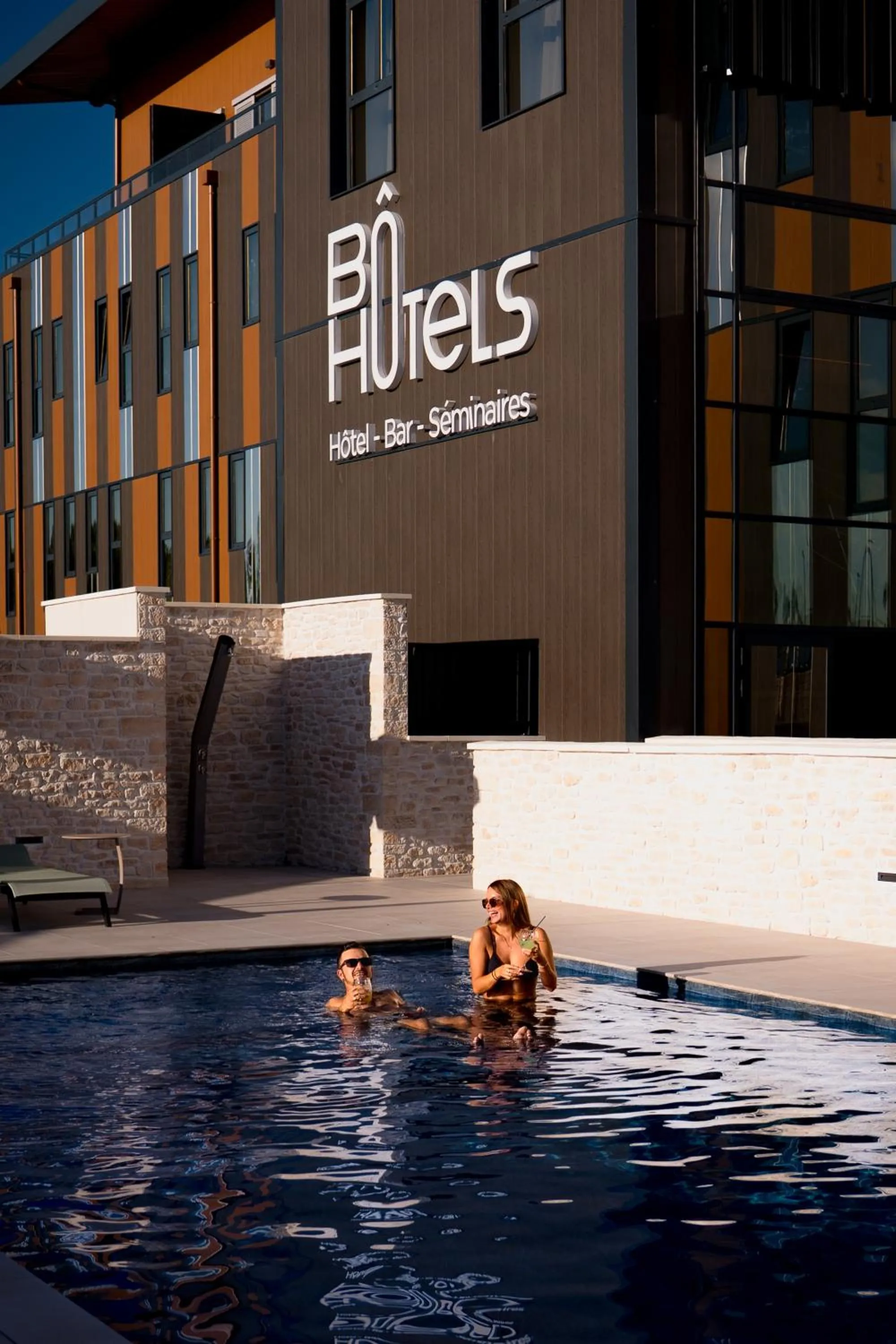 Swimming pool in Bô Hôtels Ambronay