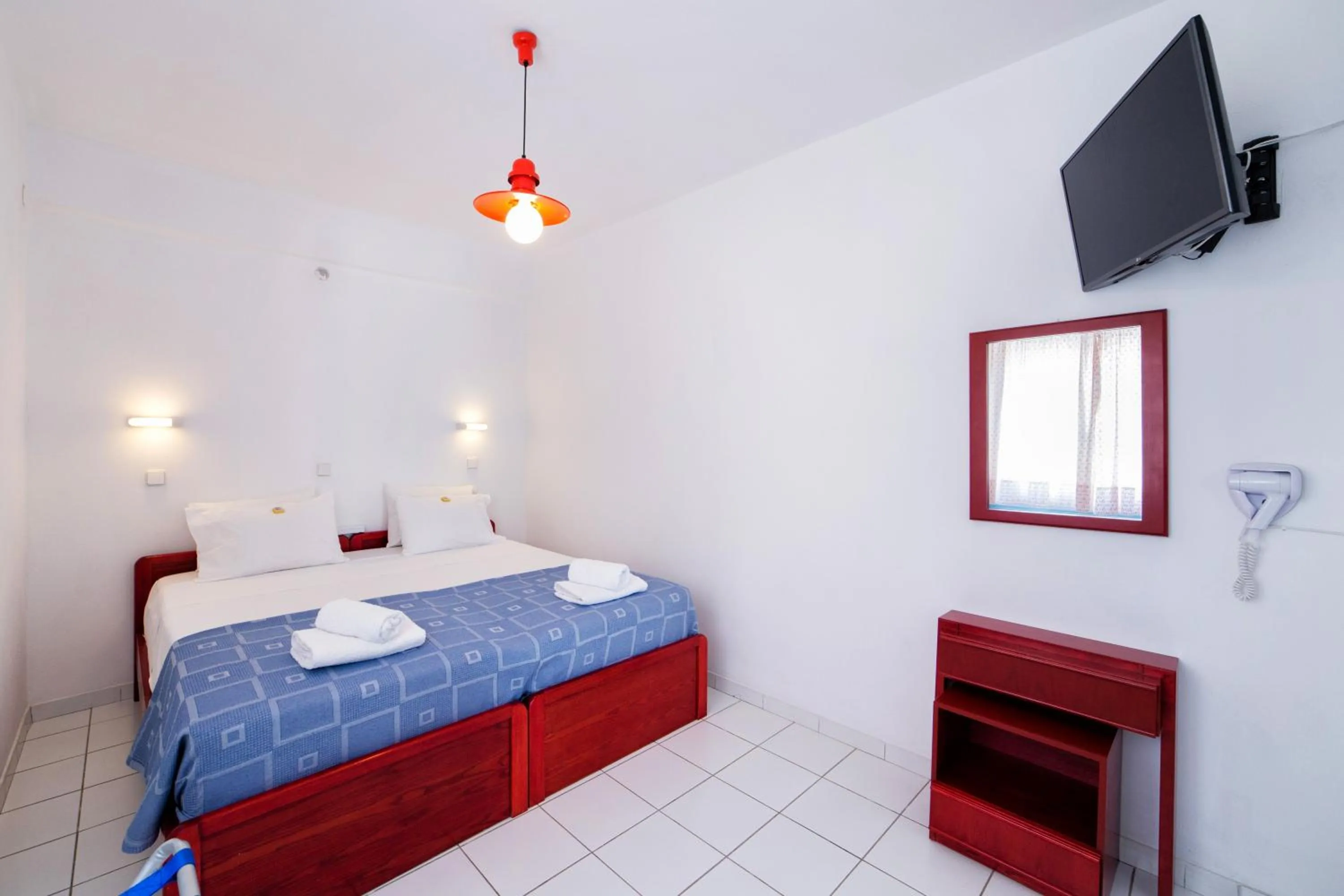 Bed in Fivos Apartments