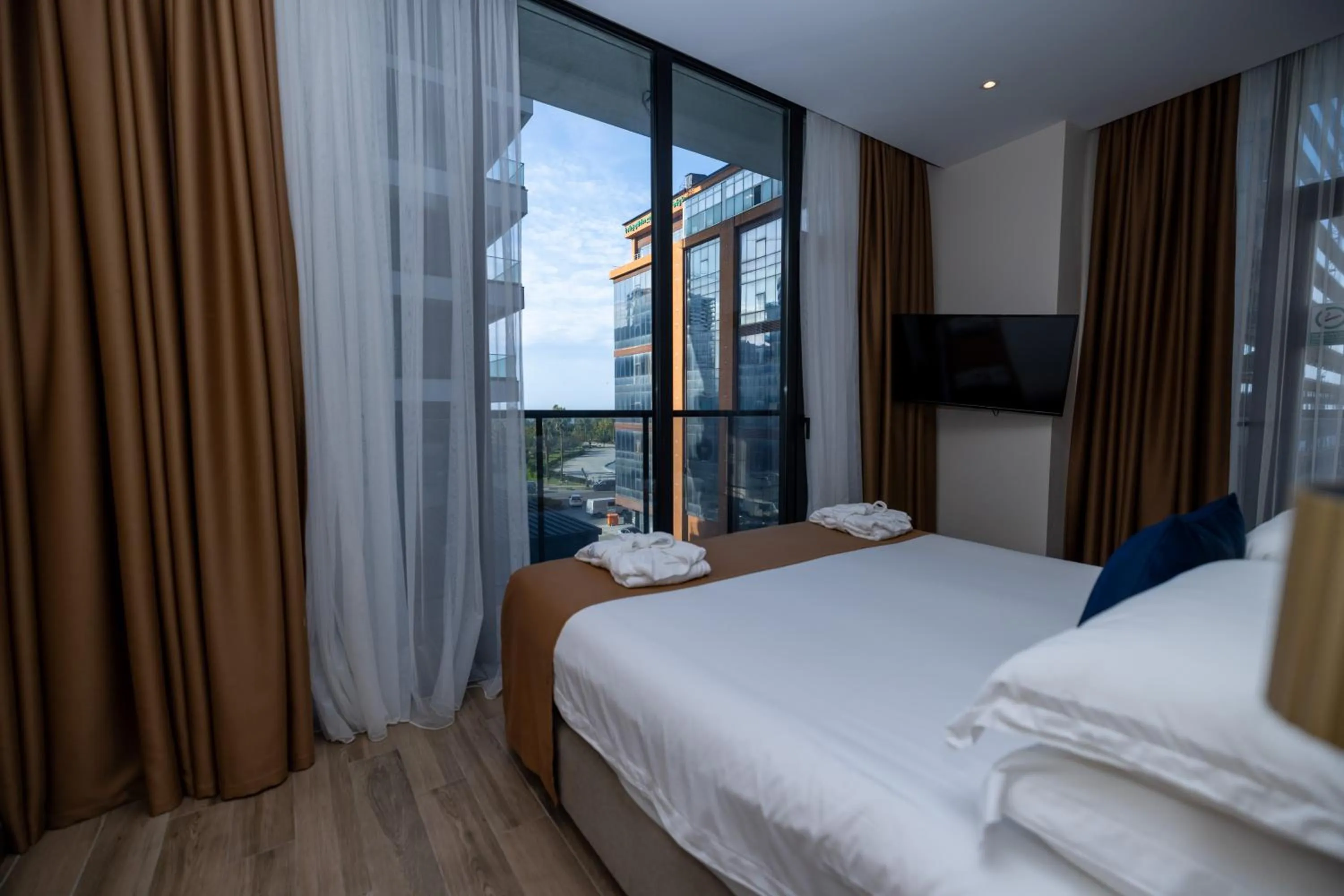 Property building, Bed in New Wave Apart-Hotel