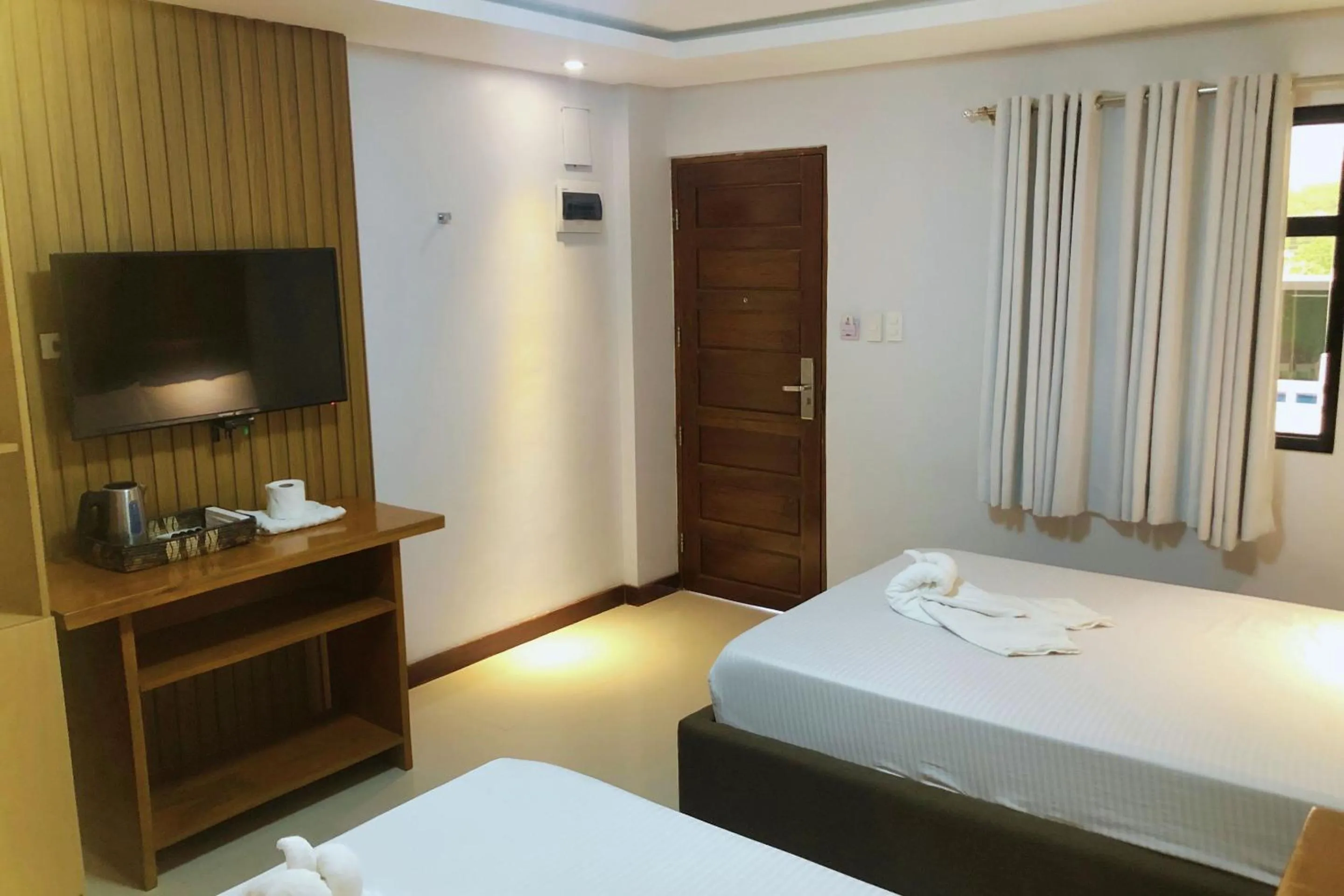 Bed in Orient De Galera Beach Resort