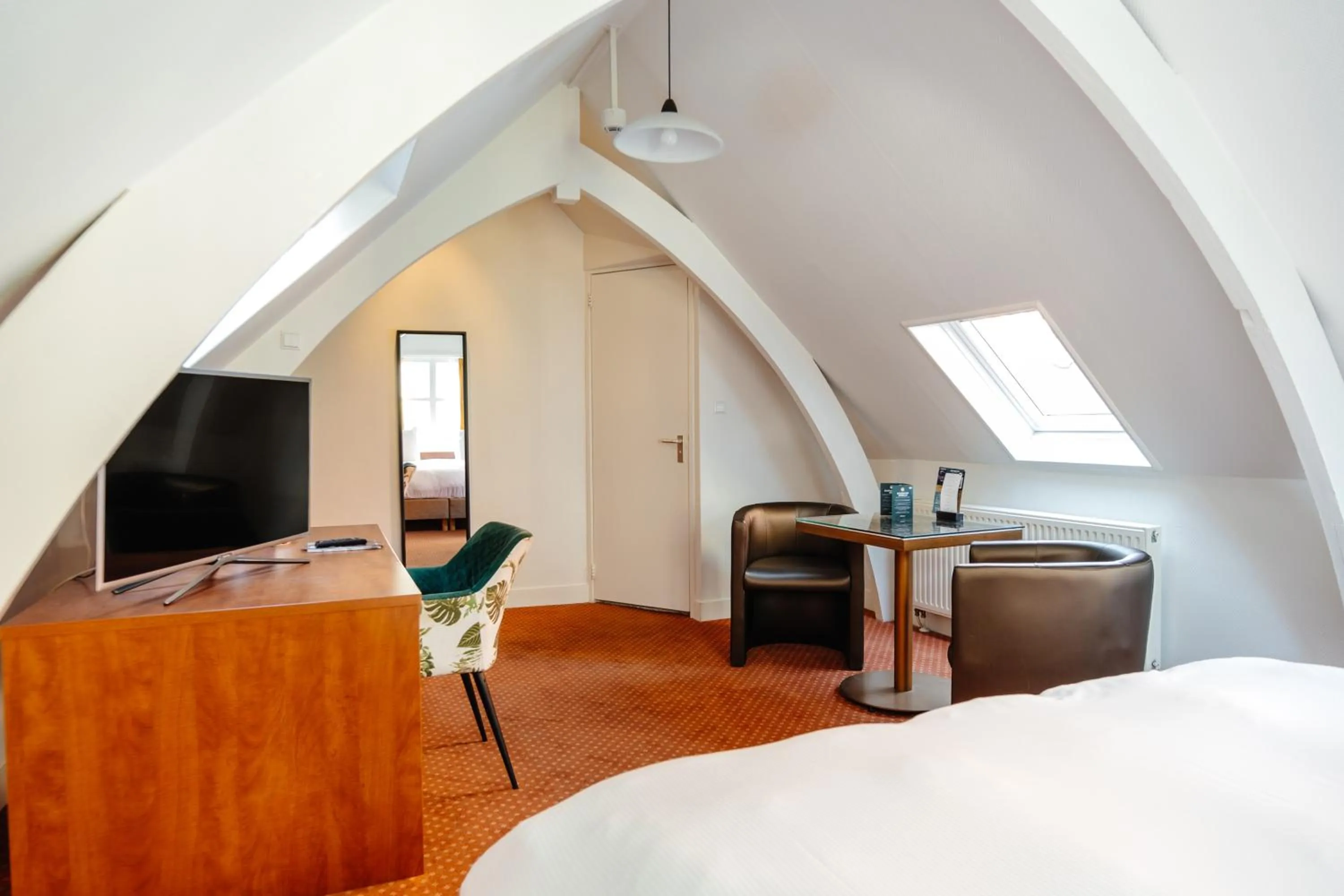 Bed in Ambassador City Centre Hotel