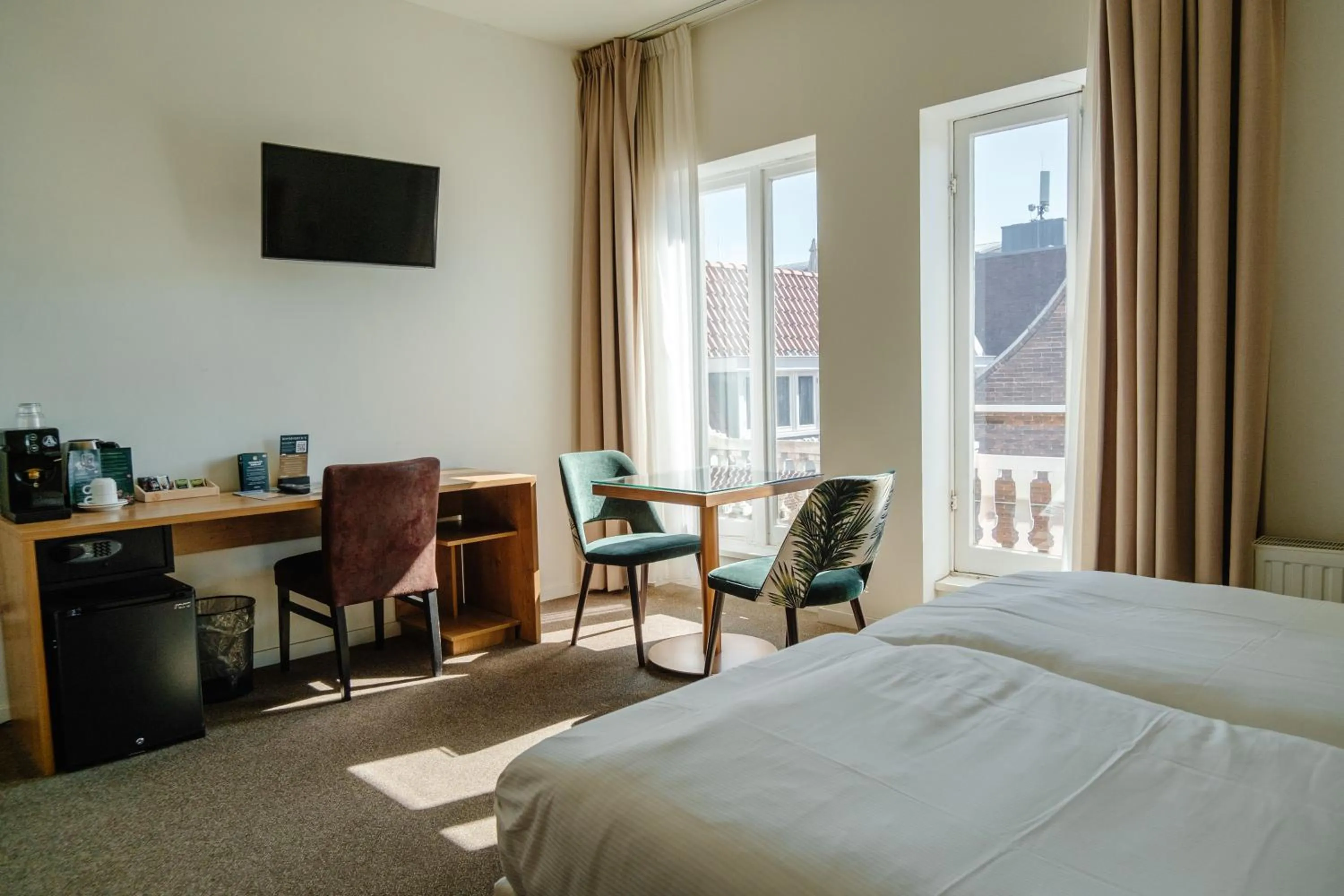 Bed in Ambassador City Centre Hotel