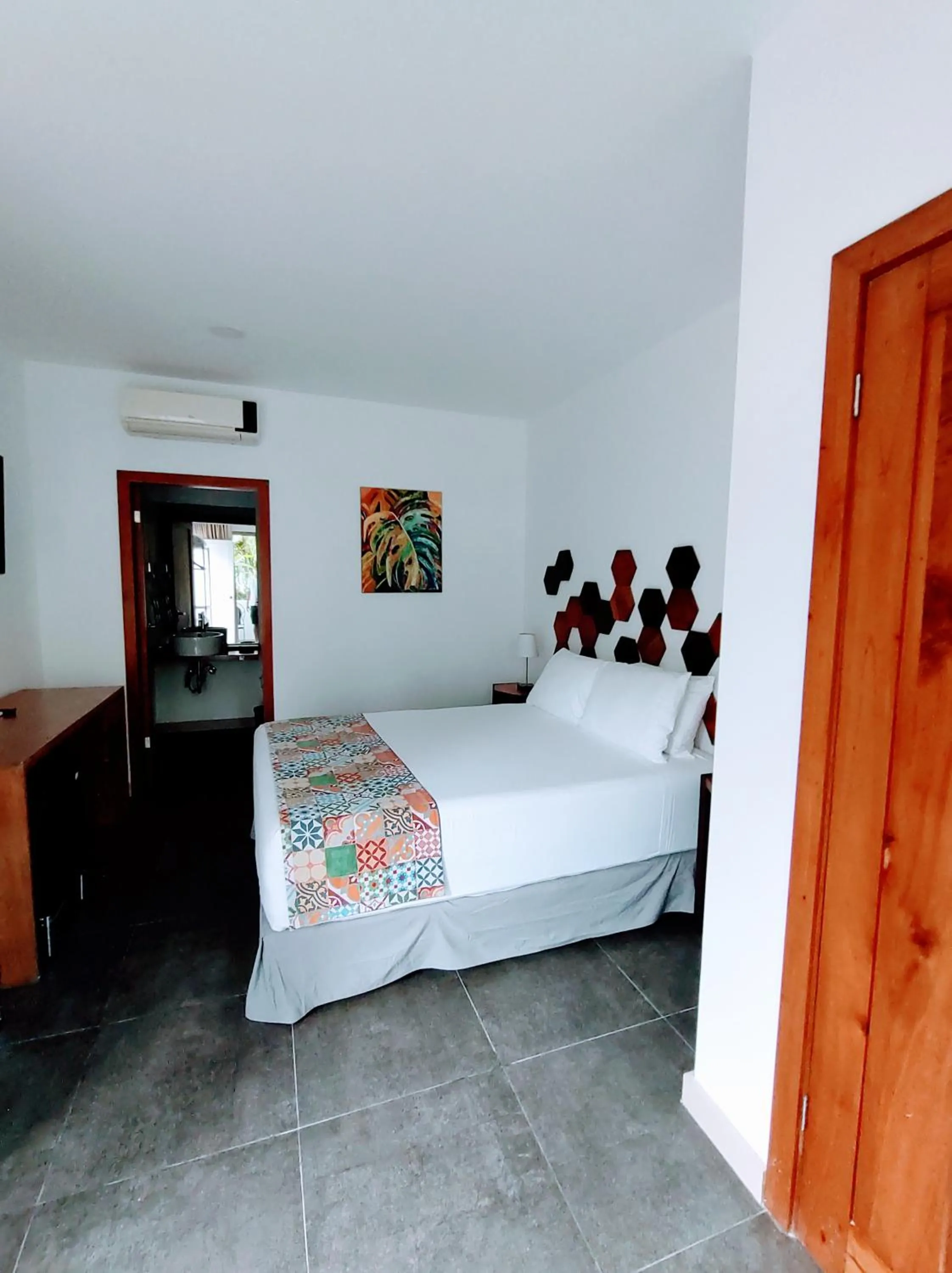 Bed in La Vela Boutique Hotel