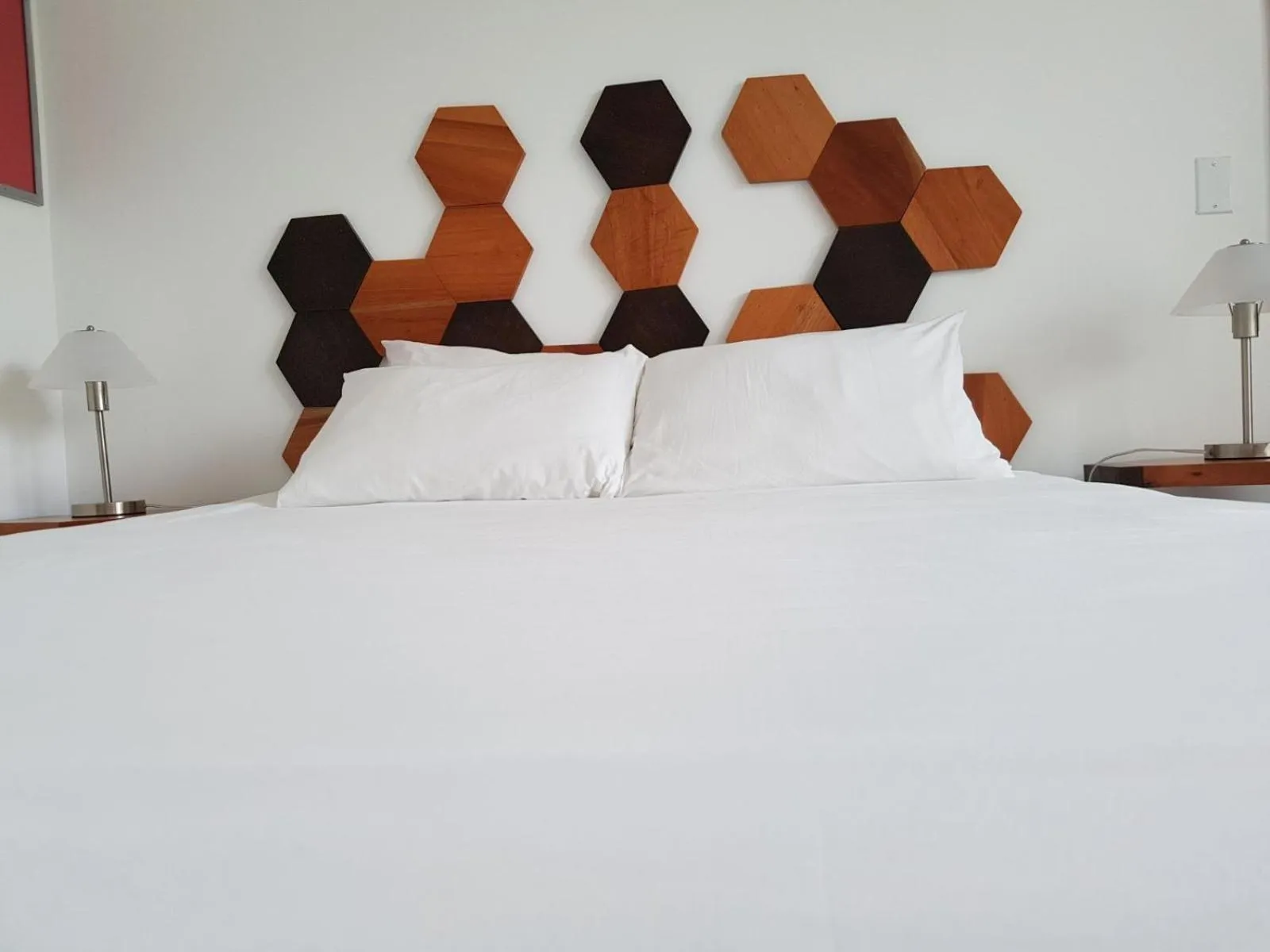 Bed in La Vela Boutique Hotel