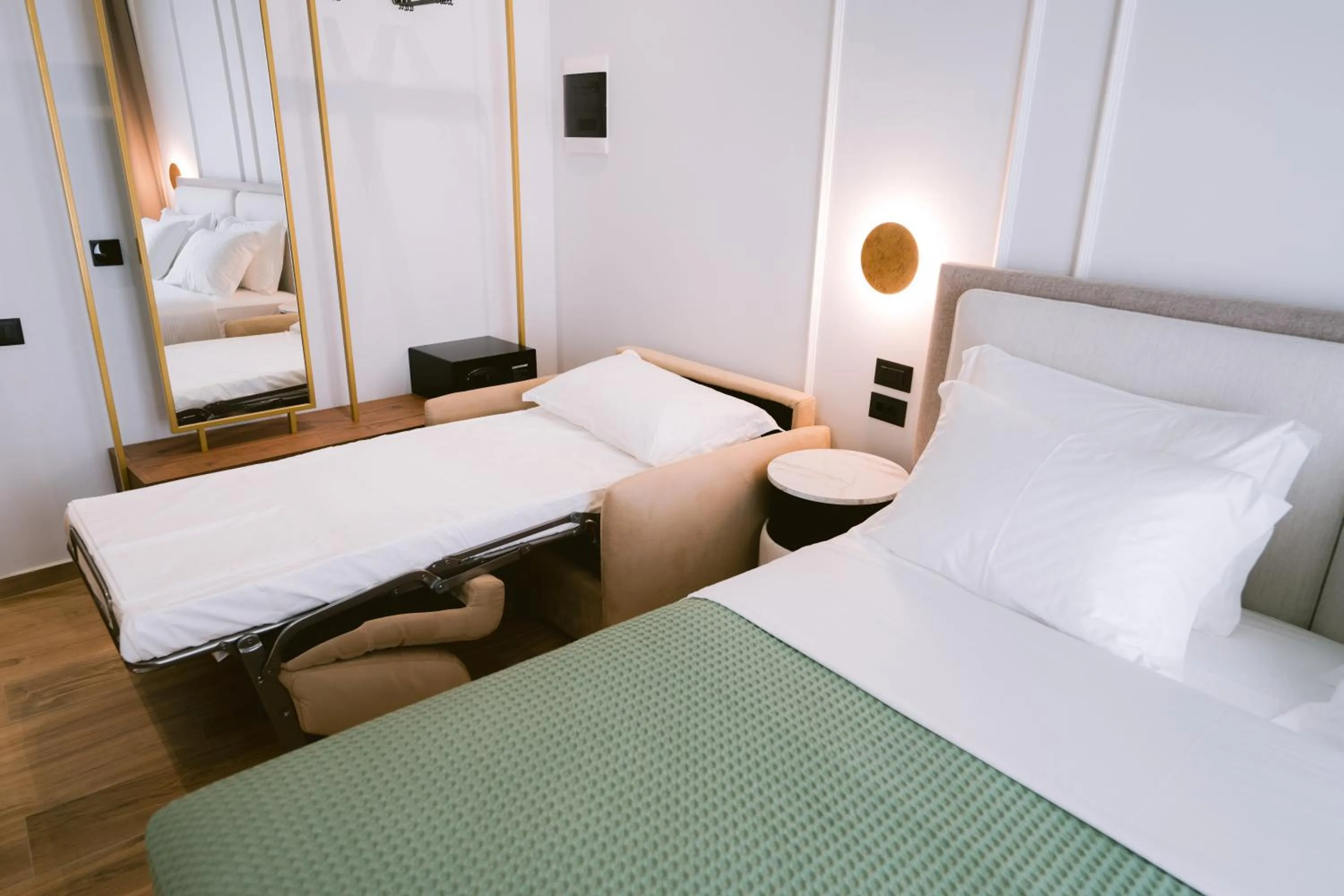 Living room, Bed in Noemie Hotel