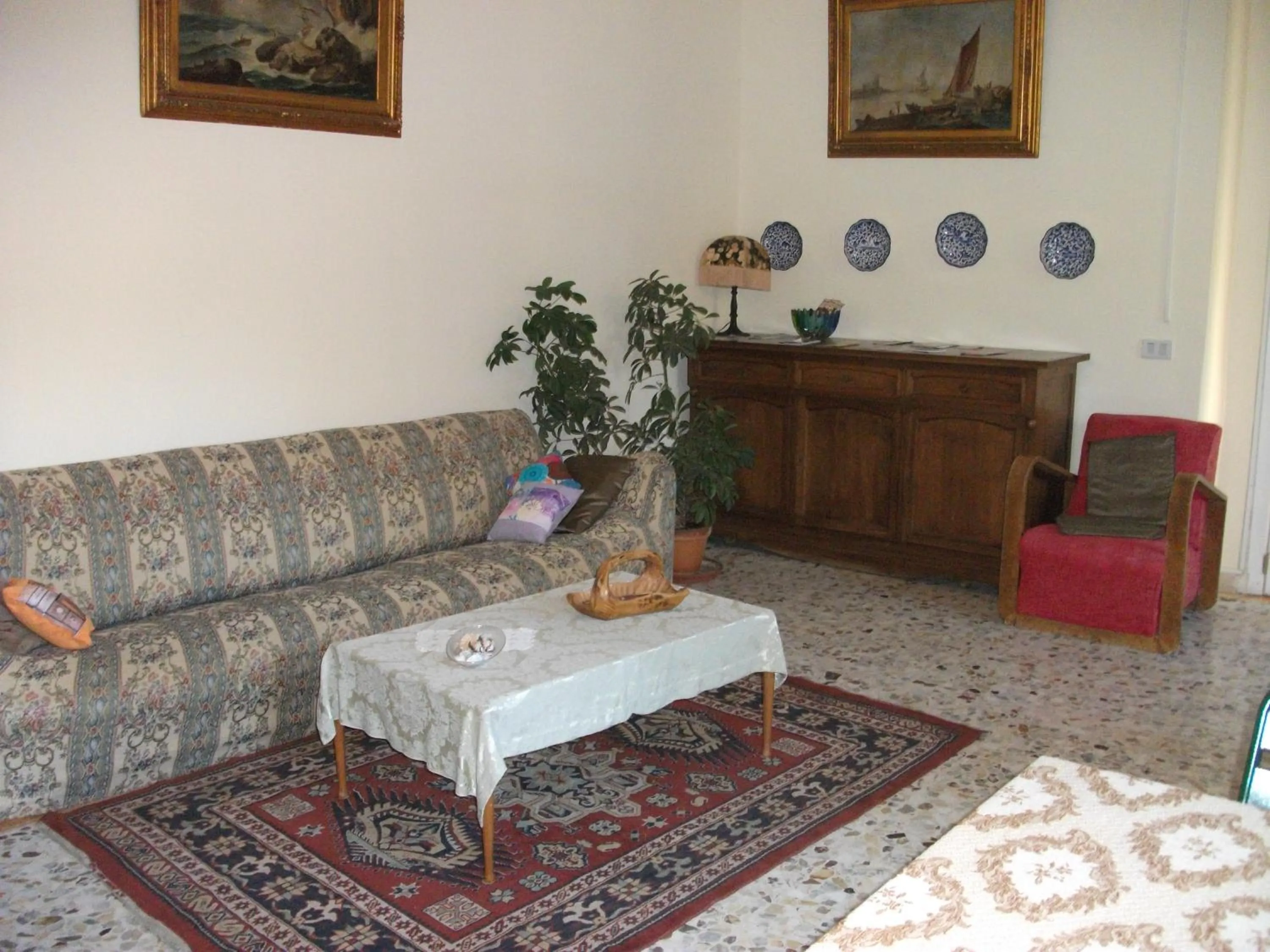 Communal lounge/ TV room in B&B La Principessa