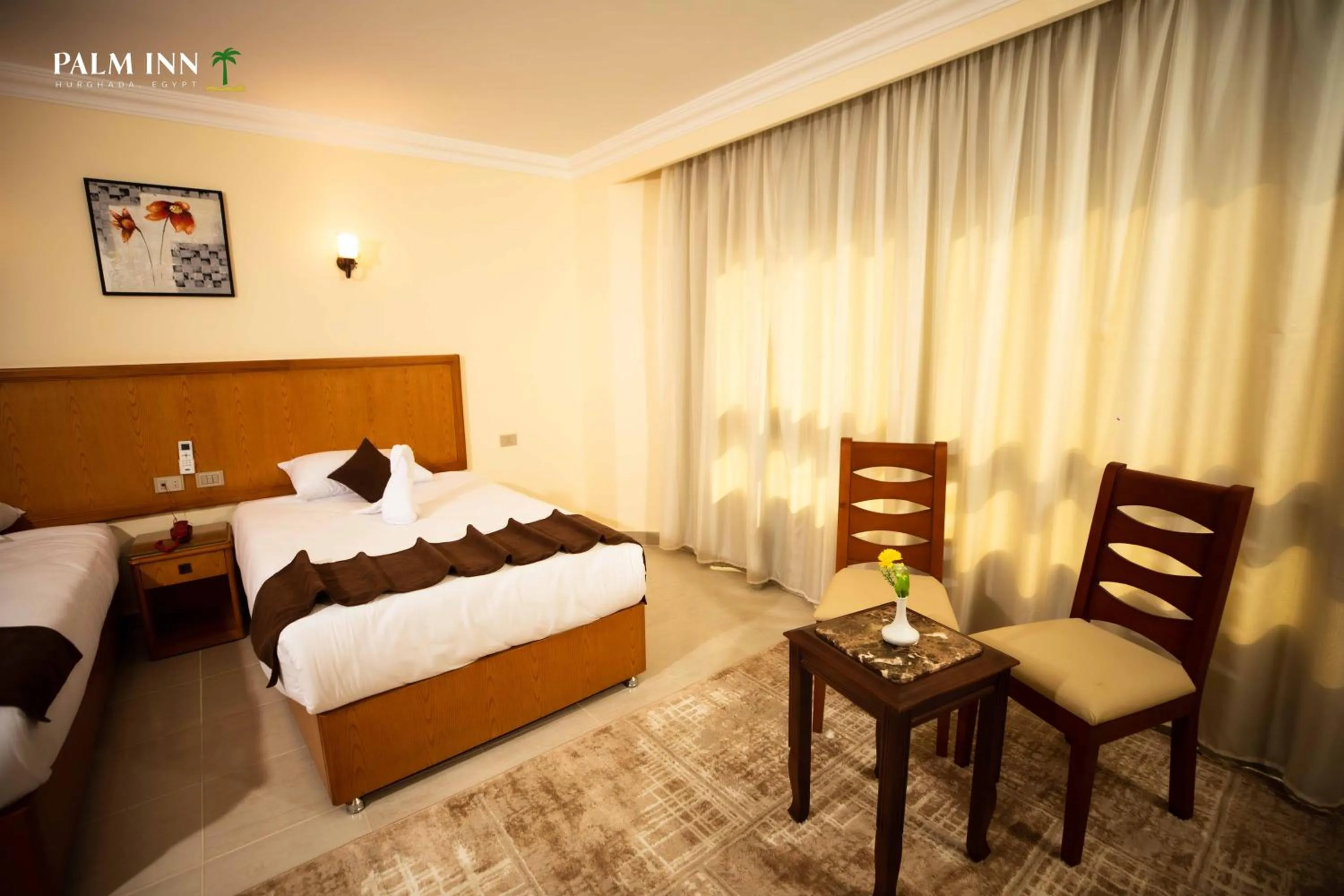 Bed in Palm Inn Hotel Hurghda