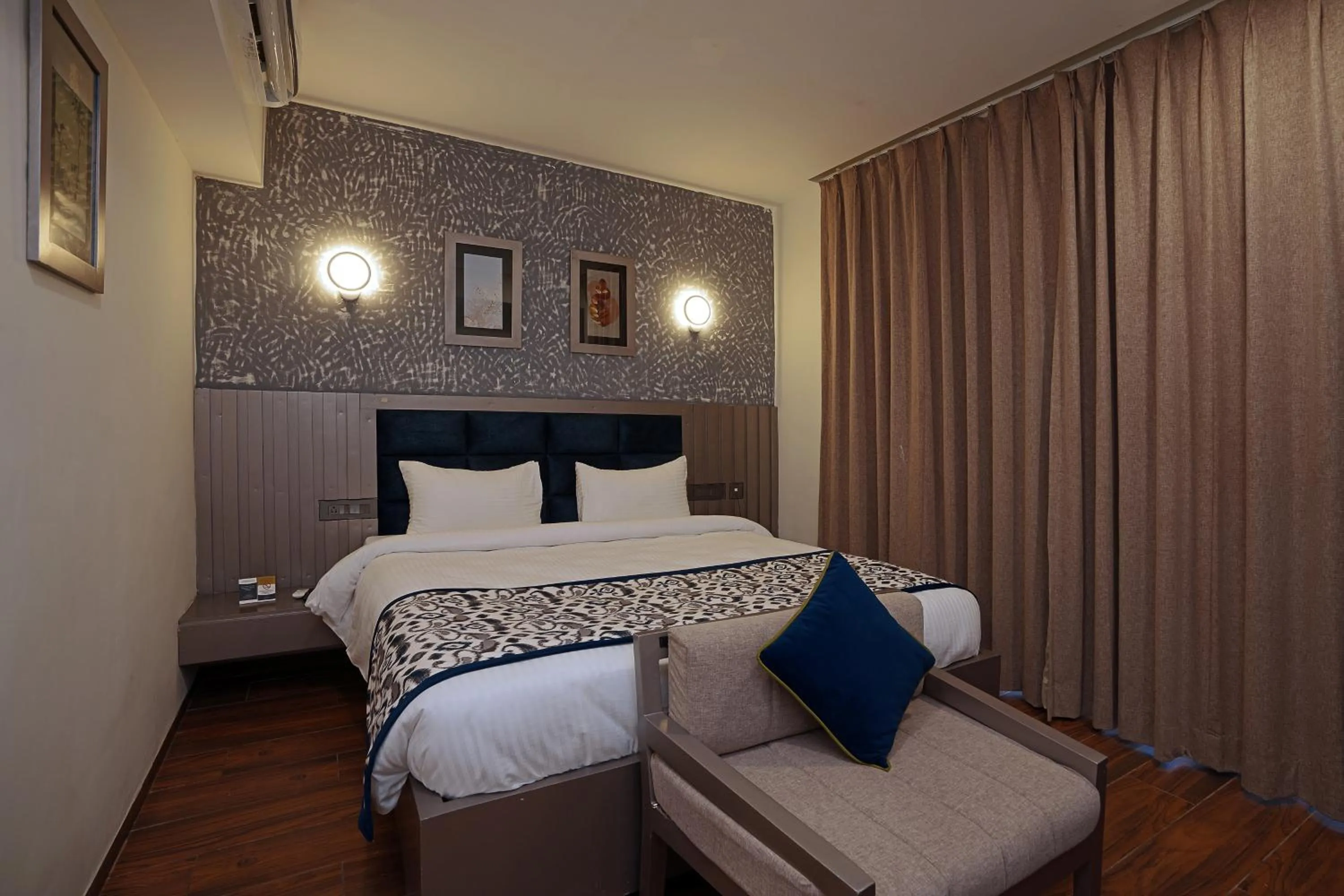 Bedroom, Bed in Grand Continent Anjuna A Sarovar Portico Affiliate Hotel