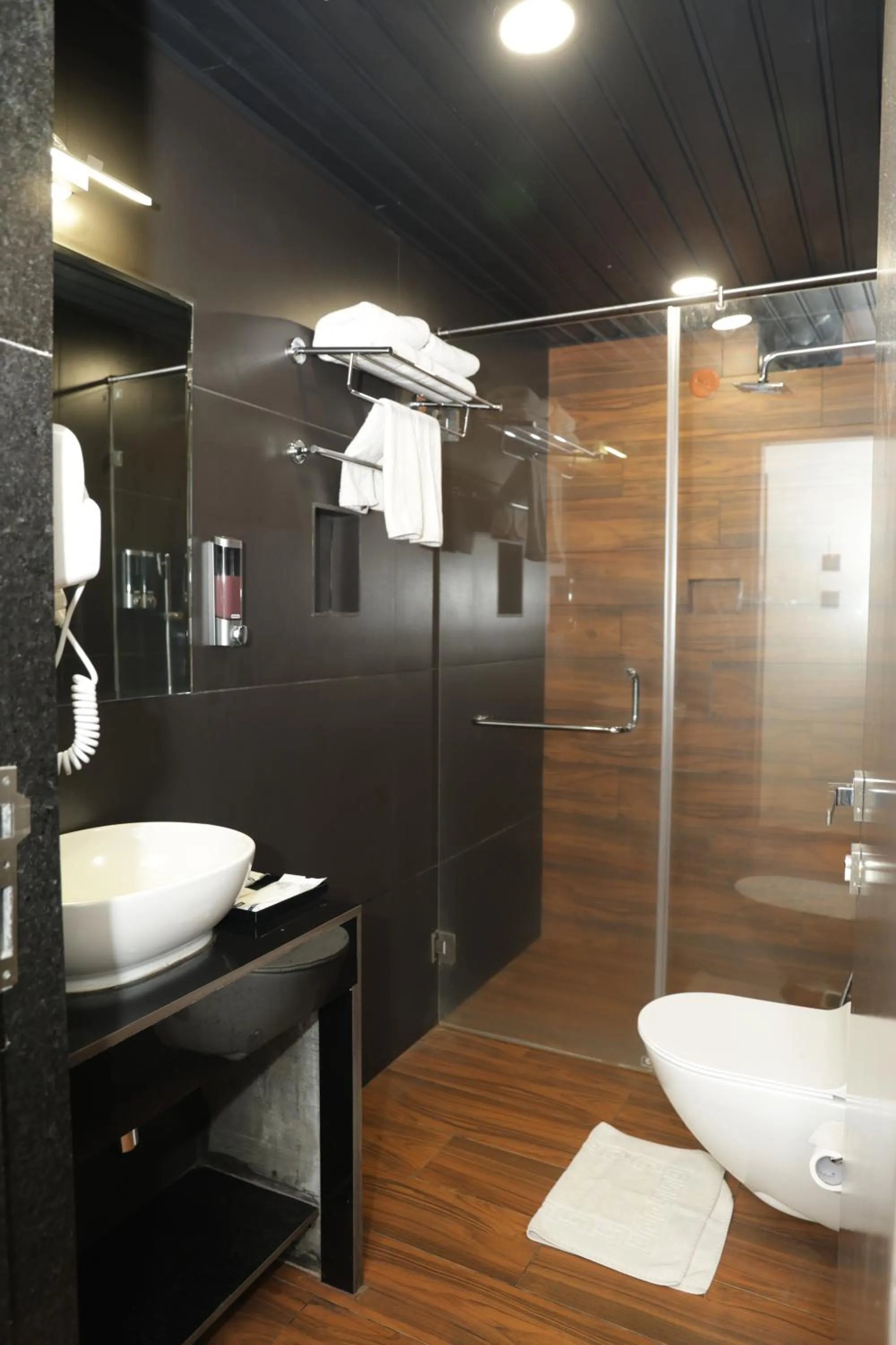 Shower in Grand Continent Anjuna A Sarovar Portico Affiliate Hotel