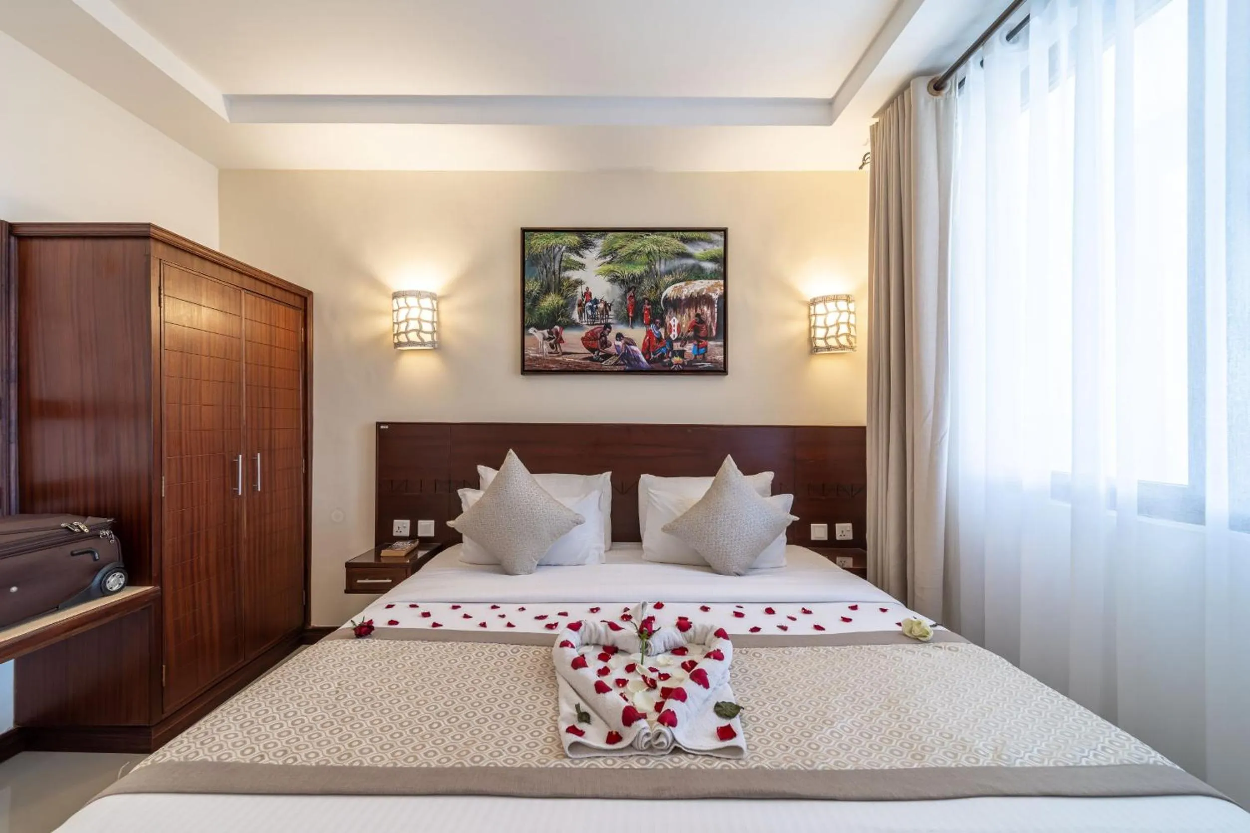 Bed in PrideInn Hotel Diani