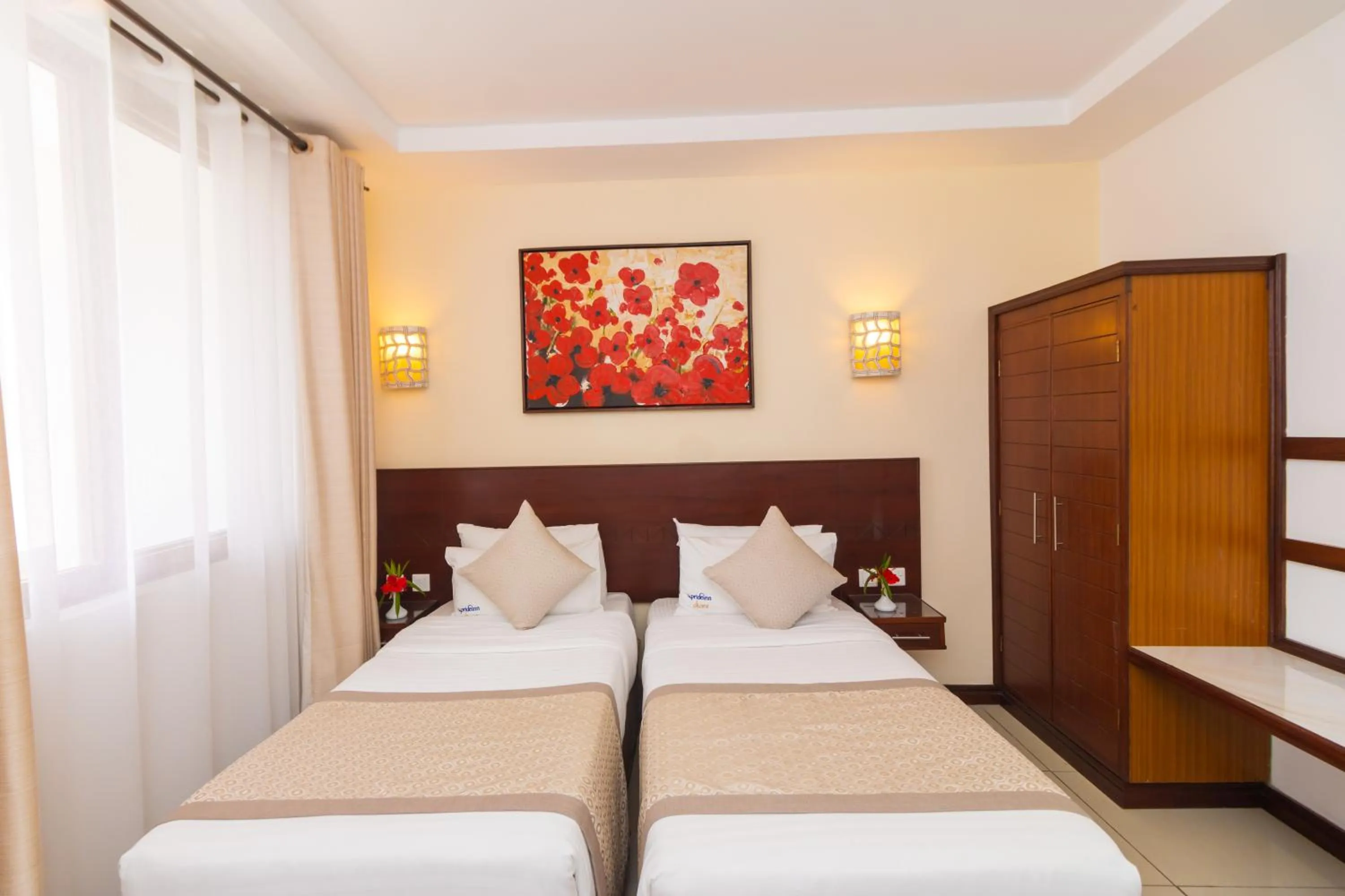 Bed in PrideInn Hotel Diani