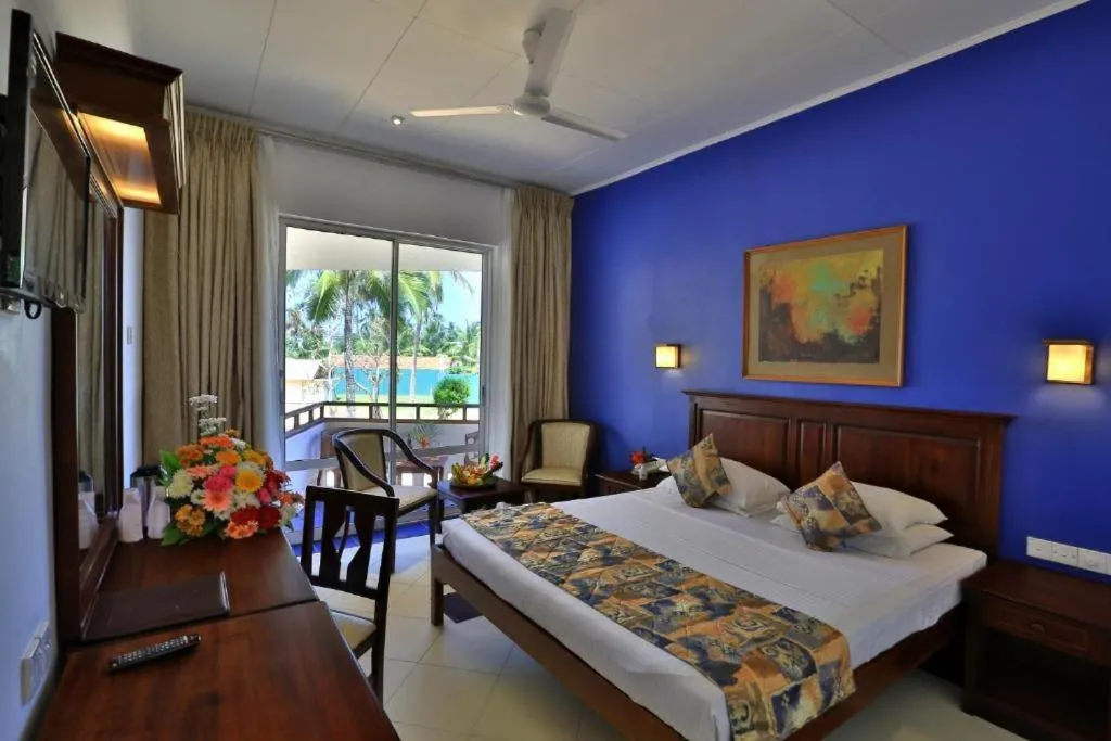 Bed in Hibiscus Beach Hotel & Villas
