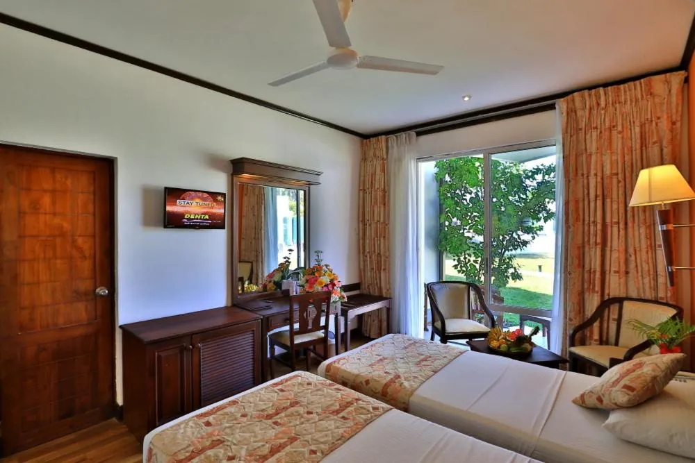 Photo of the whole room, Bed in Hibiscus Beach Hotel & Villas
