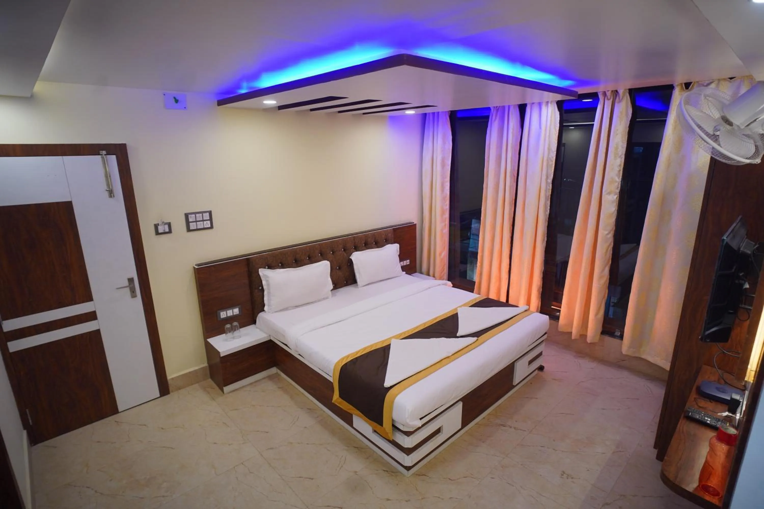 Bed in Hotel Asha Inn