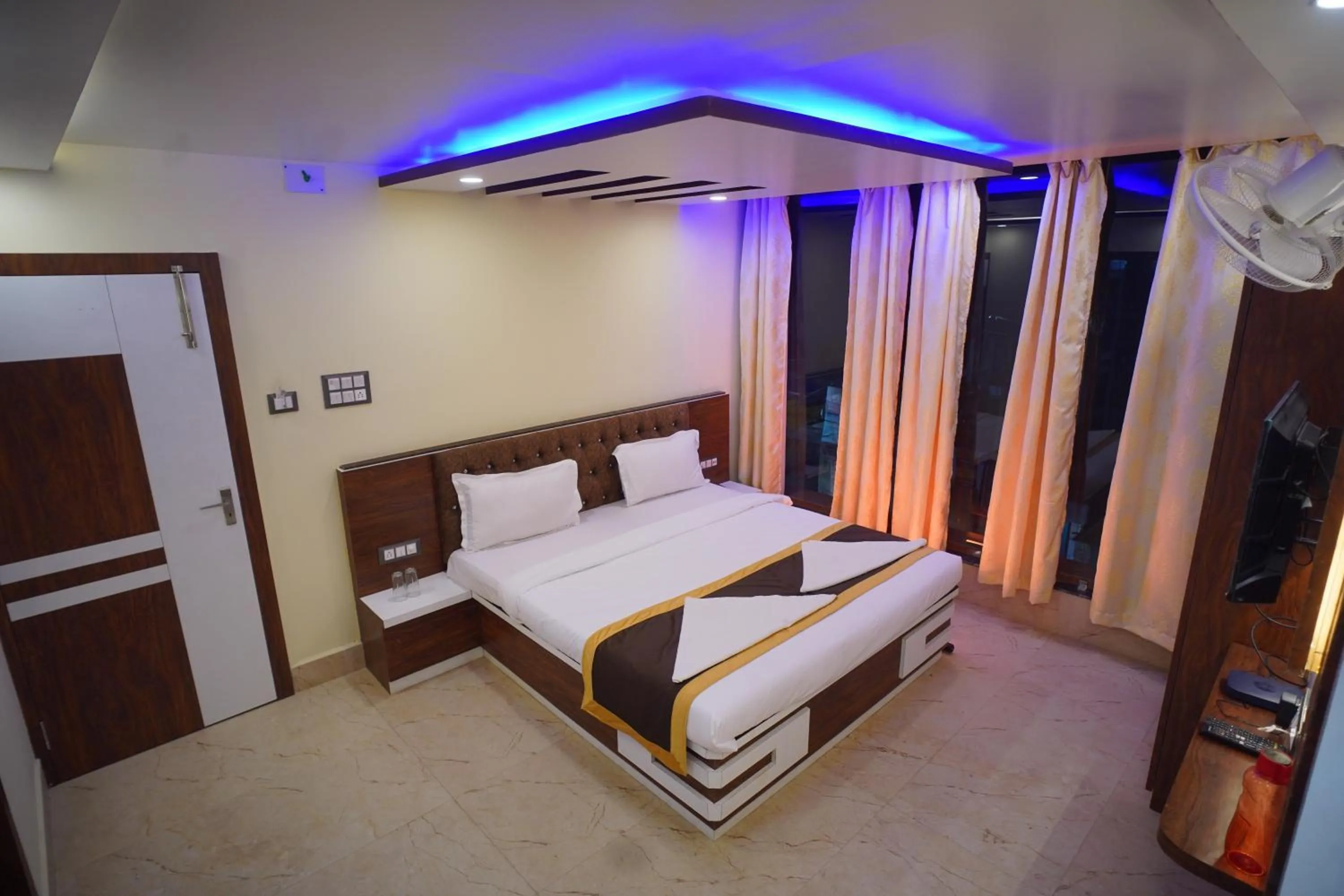 Bed in Hotel Asha Inn