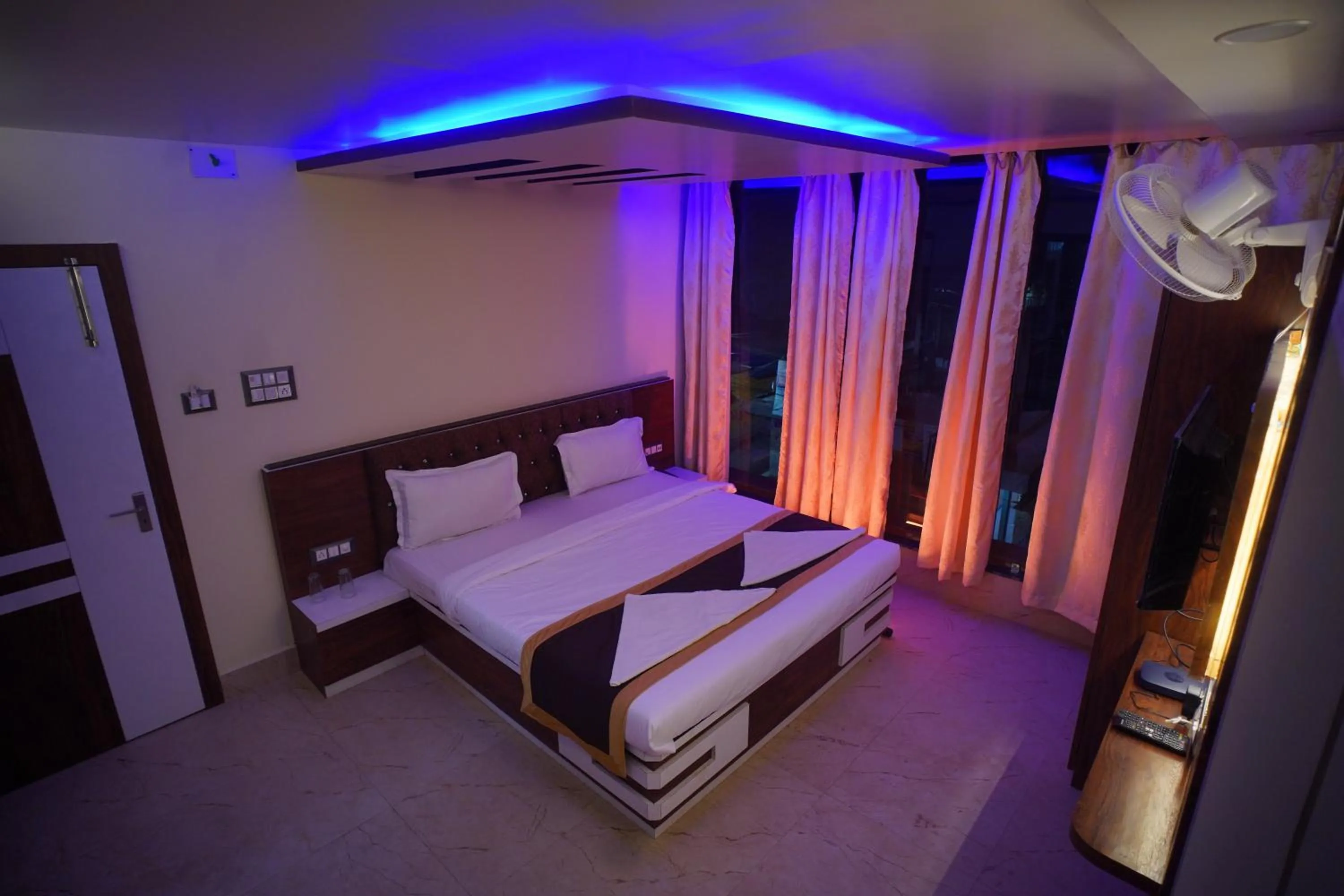 Bedroom in Hotel Asha Inn