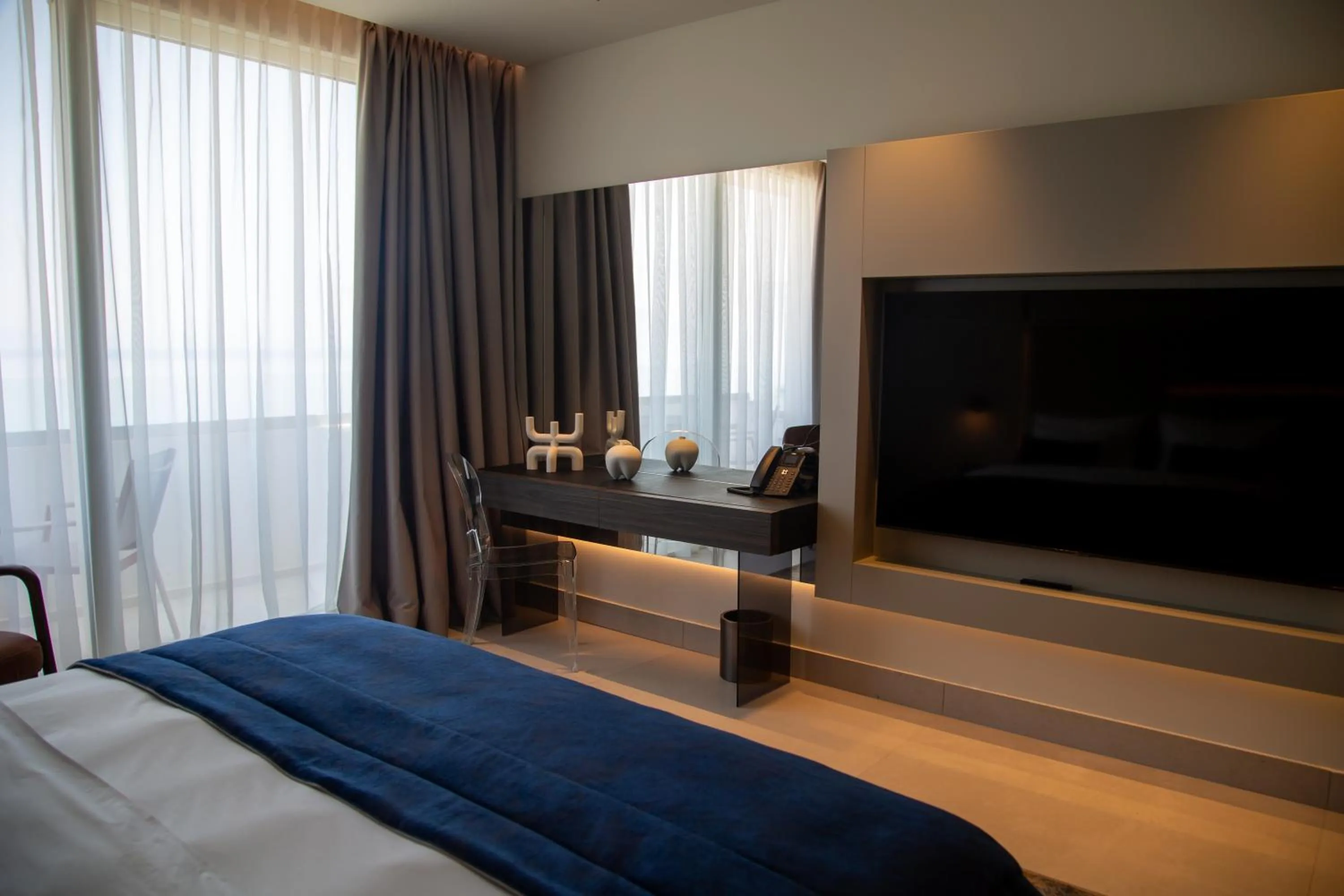 Communal lounge/ TV room, Bed in Abi's Hotel & SPA Vlore