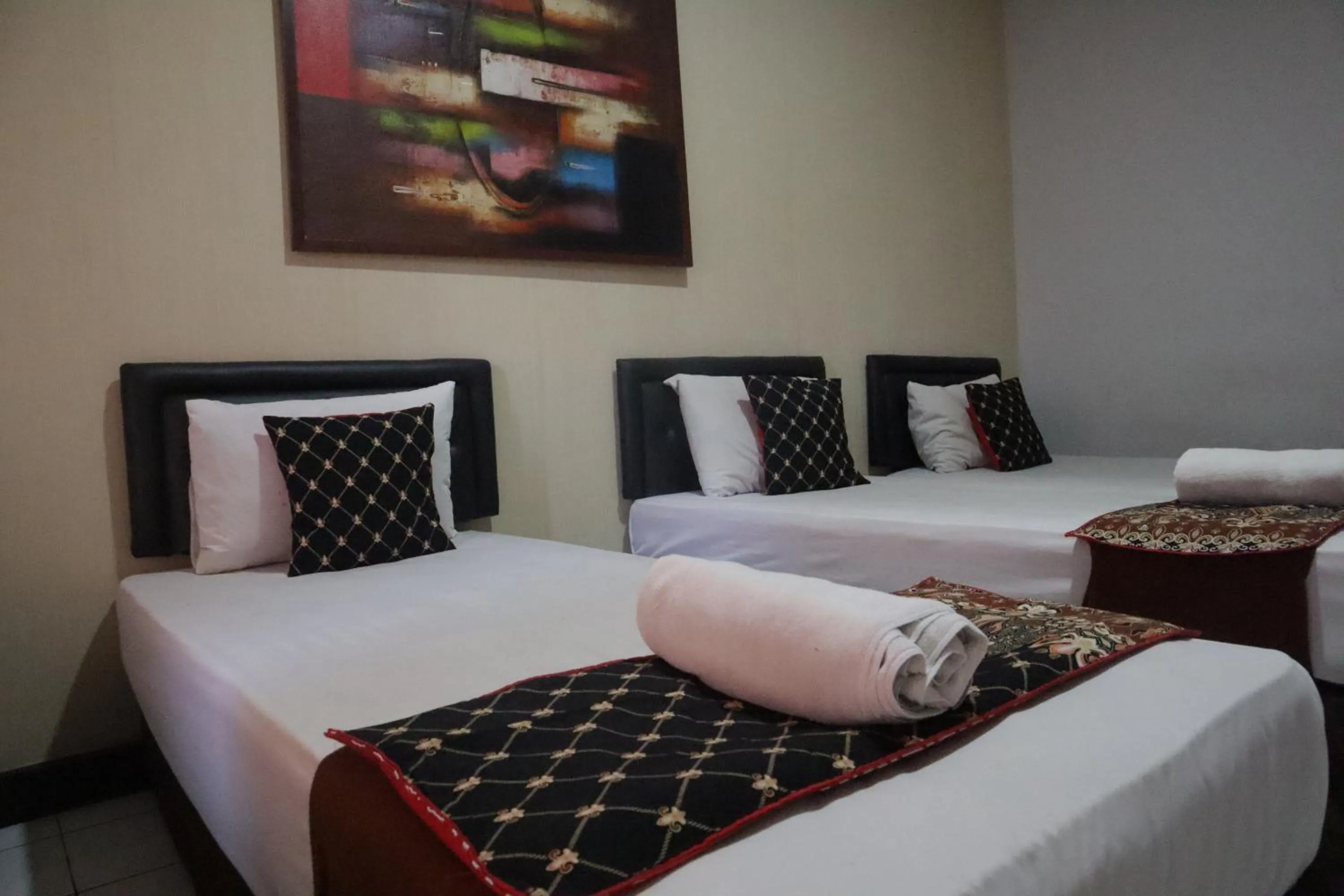 Bed in Hotel Bumi Kitri