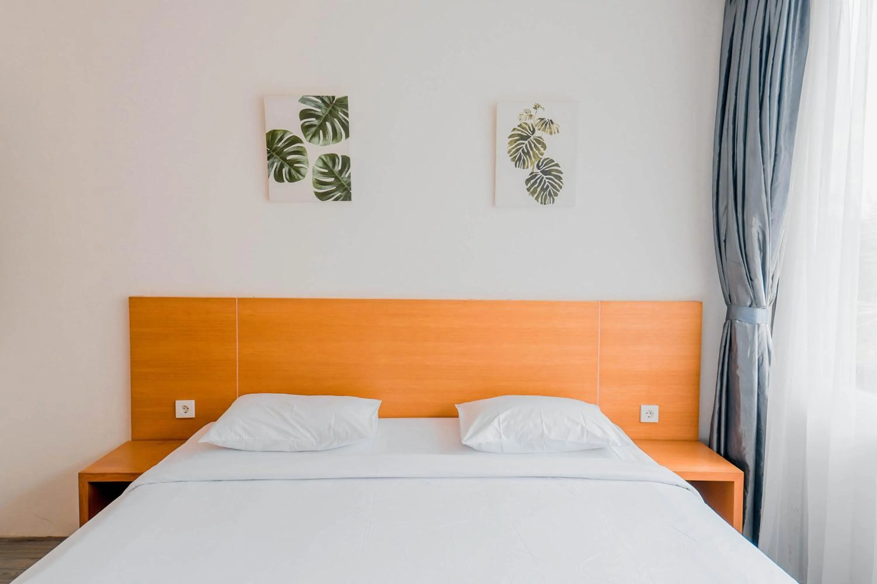 Bed in Sunrise Suite Seminyak by ARM Hospitality