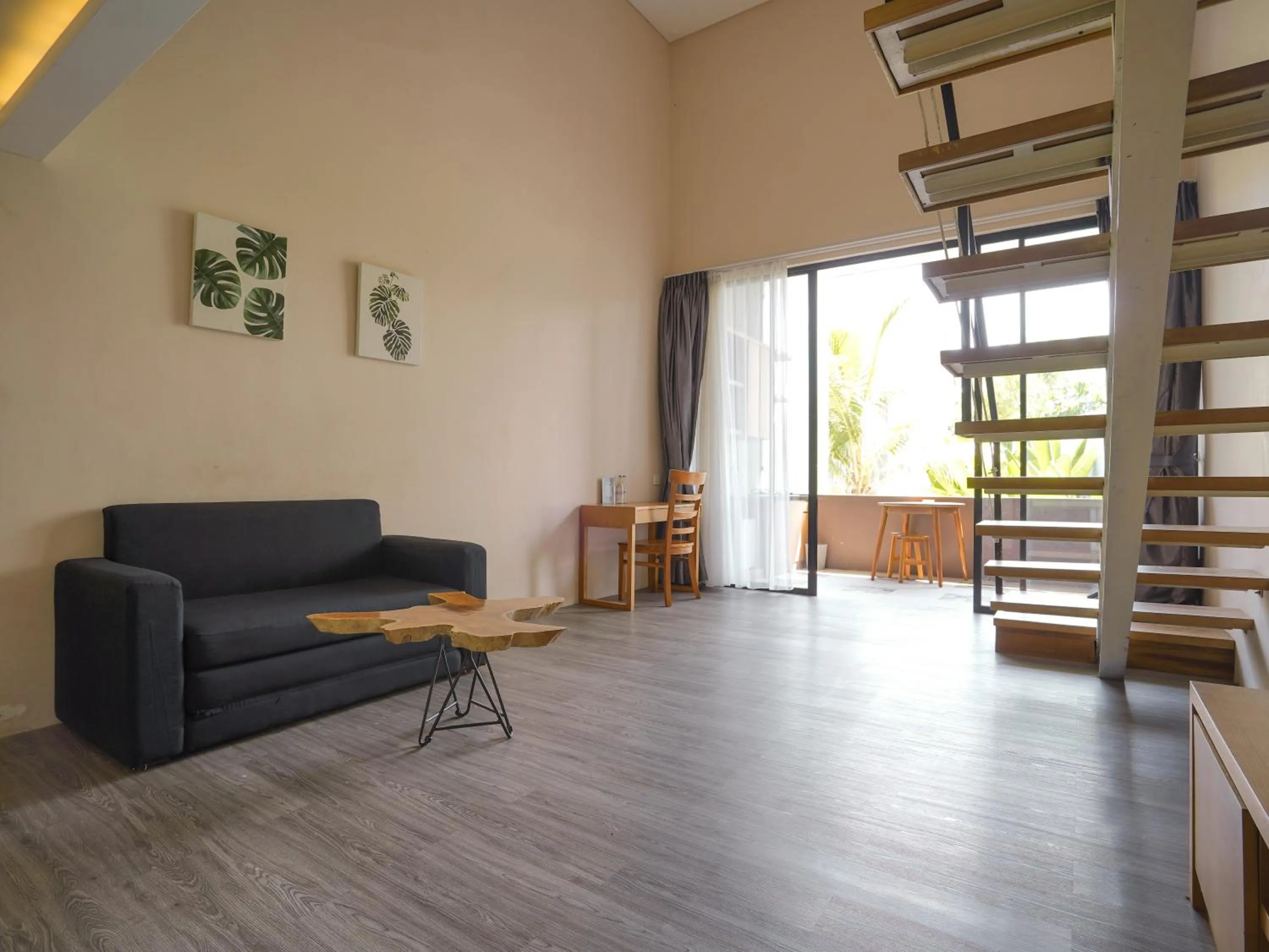 Living room in Sunrise Suite Seminyak by ARM Hospitality