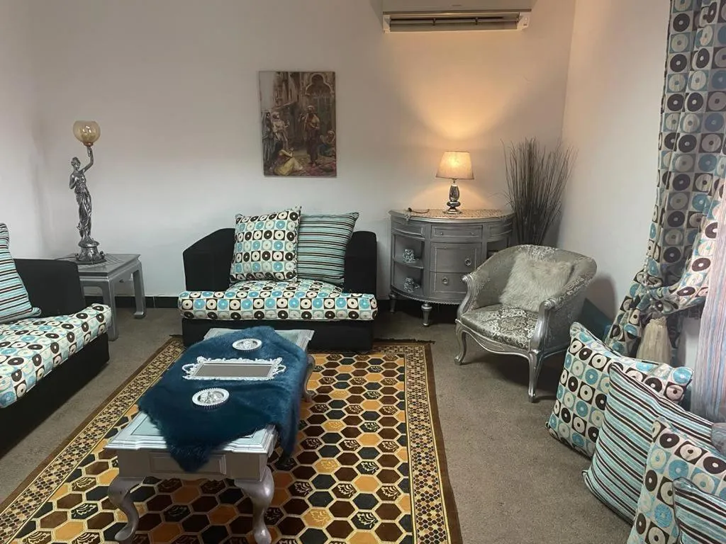 Living room in One bedroom apartment city views local to Airport