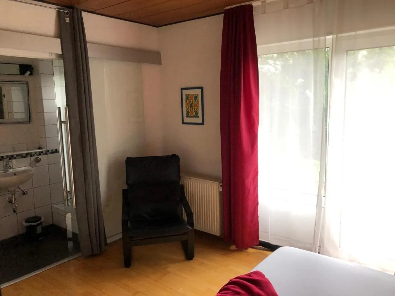 Seating area, Bed in Hotel Saarland Lebach