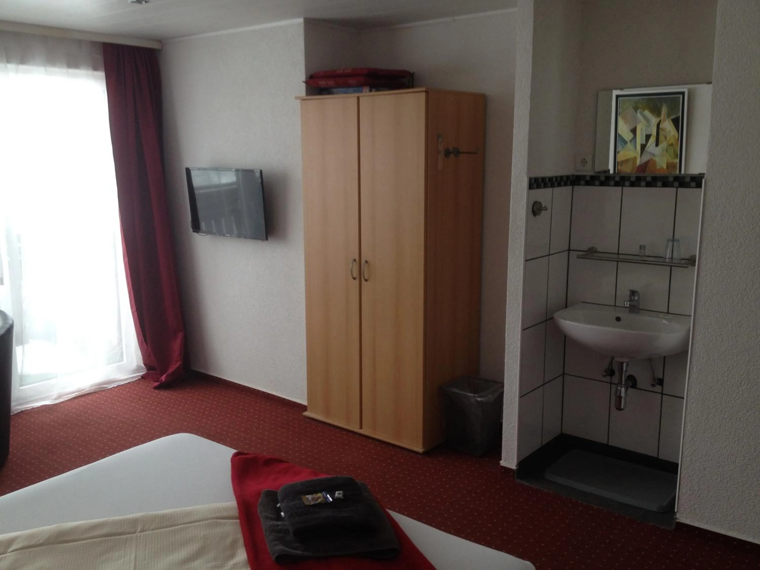 Photo of the whole room, Bed in Hotel Saarland Lebach