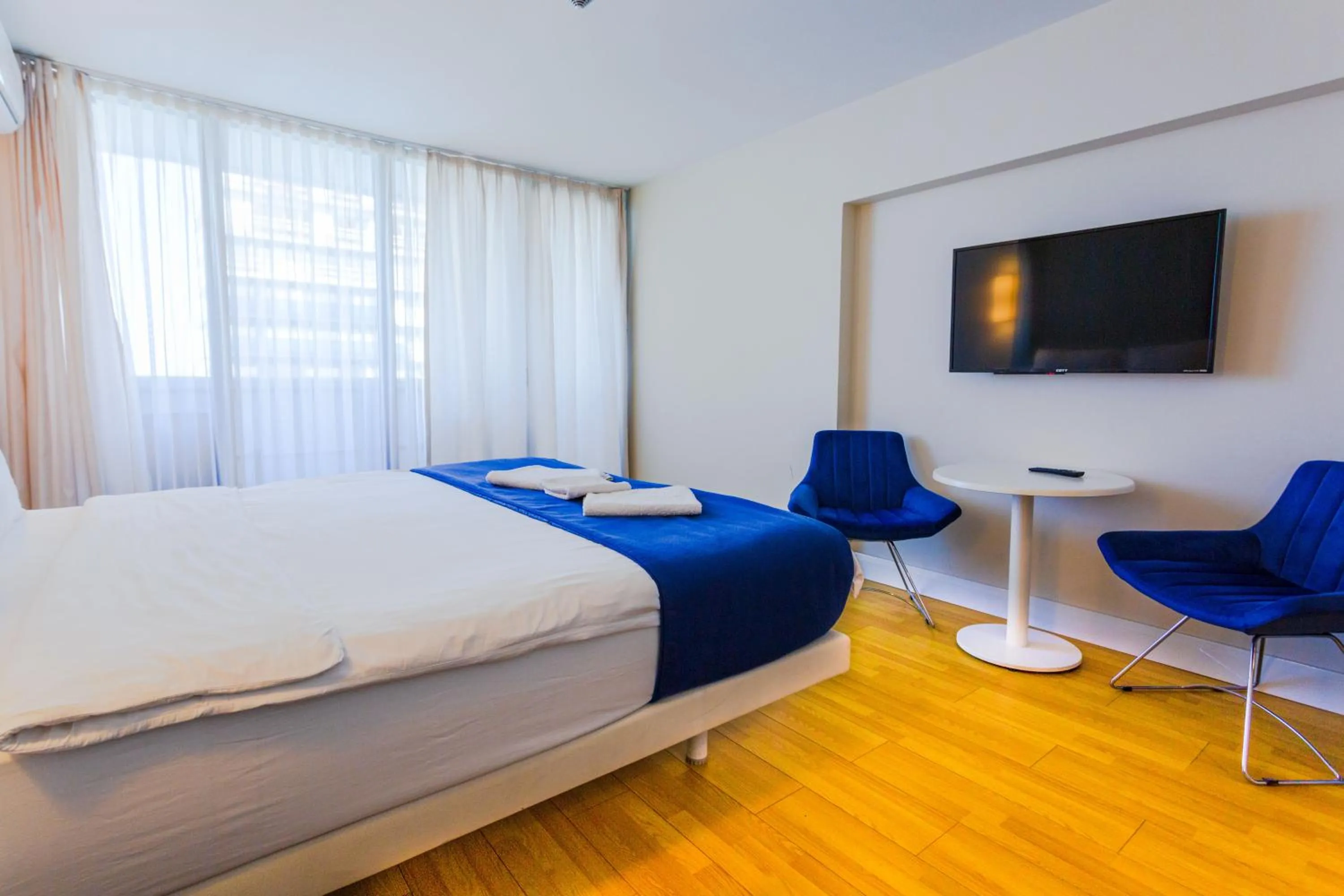 Property building, Bed in Orbi City Hotel